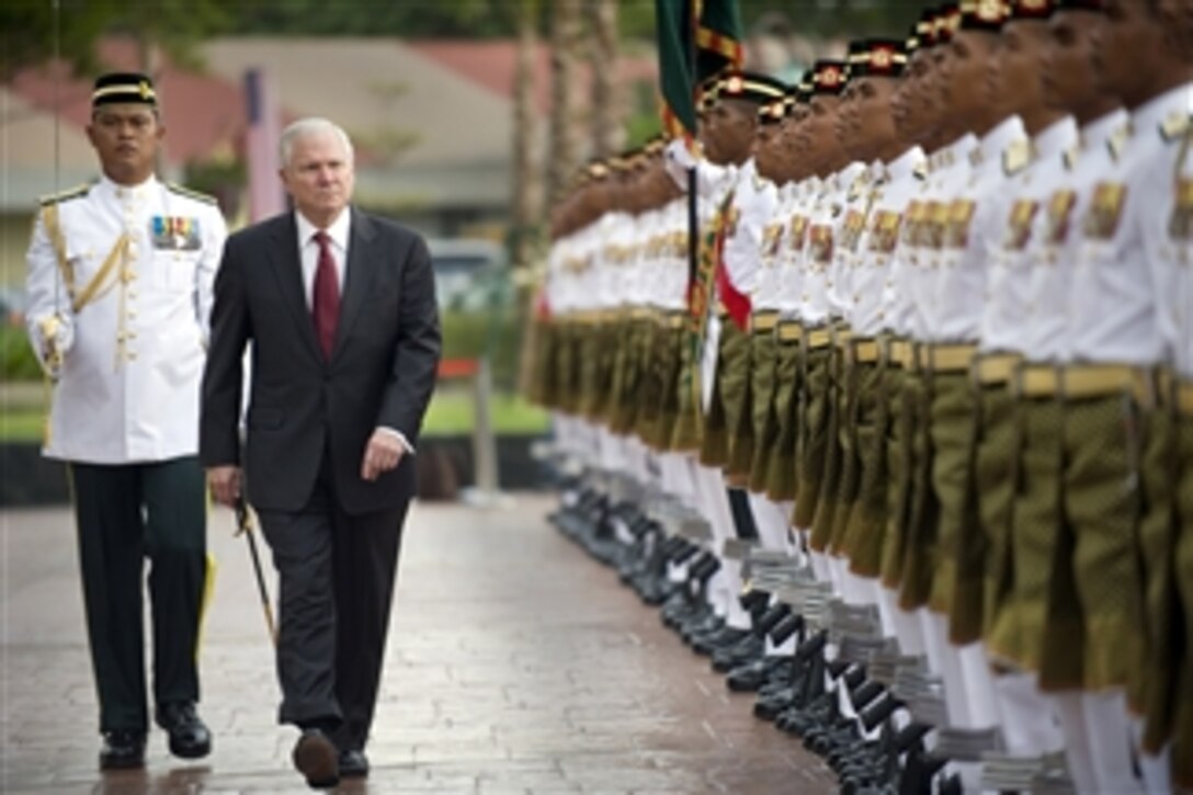 Secretary of Defense Robert M. Gates reviews the troops during an honor arrival ceremony at the Ministry of Defense in Kuala Lumpur, Malaysia, on Nov. 9, 2010.  