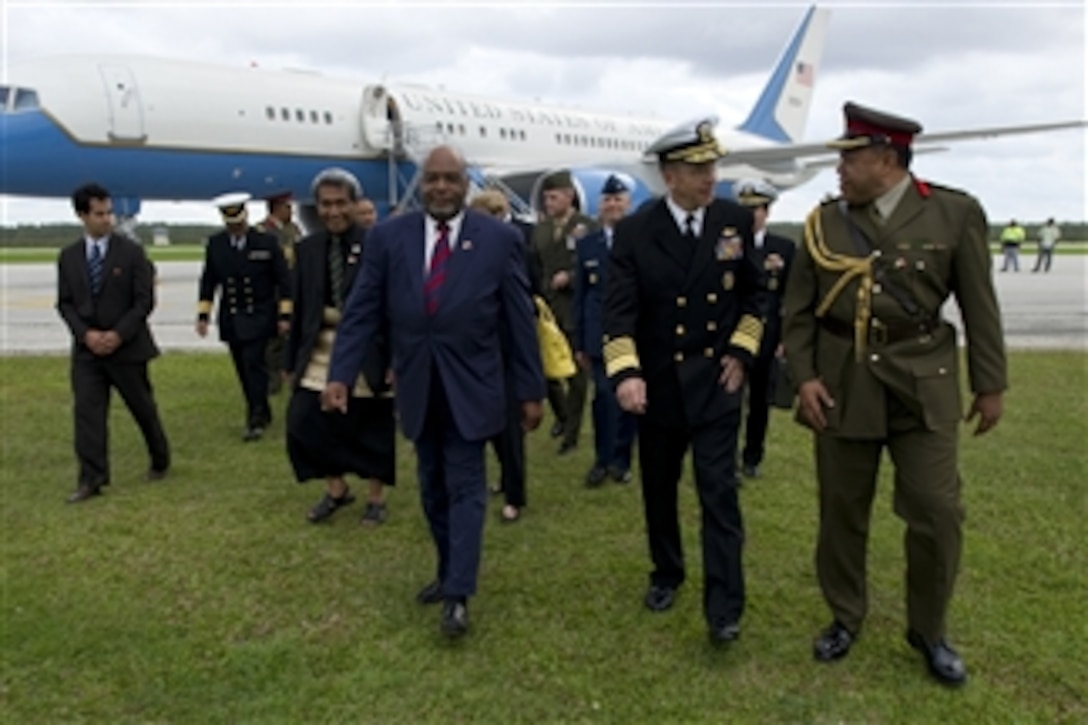 Chairman of the Joint Chiefs of Staff Adm. Mike Mullen, U.S. Navy, is welcomed to the Kingdom of Tonga by Ambassador C. Steven McGann and Brig. Gen. Tau'aika 'Dave' Uta'atu, Tonga's chief of defense, on Nov. 9, 2010.  Mullen visited Tonga on the second stop of a Pacific tour to thank the Tongan people for their continuing dedication and support in sending troops to Iraq and Afghanistan.  