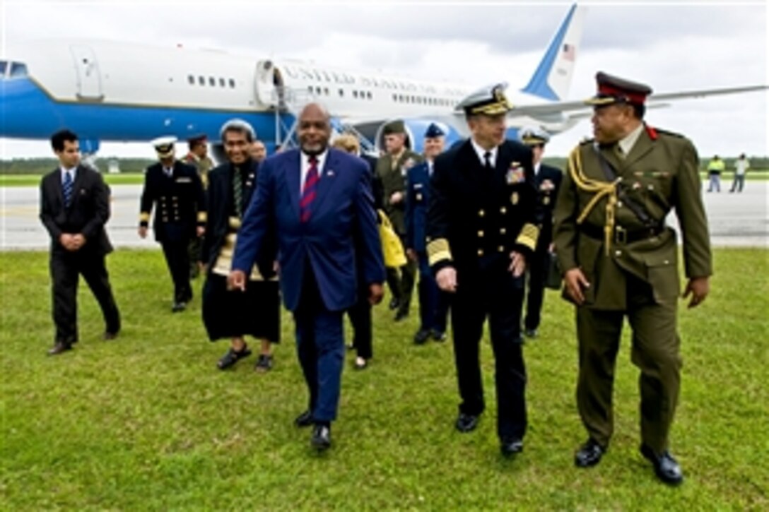 U.S. Ambassador to Tonga C. Steven McGann and Brig. Gen. Tau'aika "Dave" Uta'atu, Tonga's chief of defense, greet U.S. Navy Adm. Mike Mullen, chairman of the Joint Chiefs of Staff, upon his arrival in Tonga, Nov. 9, 2010. Mullen visited Tonga on the second stop of a Pacific tour to thank the Tongan people for their continuing dedication and support in sending troops to Iraq and Afghanistan. 