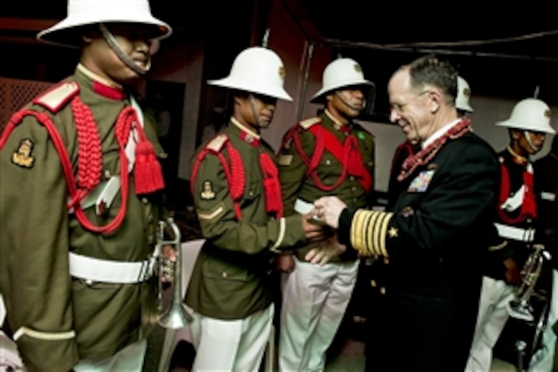 U.S. Navy Adm. Mike Mullen, chairman of the Joint Chiefs of Staff, greets Tongan Honor Guard soldiers during a visit to the kingdom, Nov. 9, 2010. Mullen visited Tonga on the second stop of a Pacific tour to thank the Tongan people for their continuing dedication and support in sending troops to Iraq and Afghanistan.










