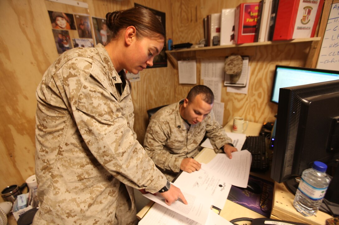 Pfc. Samuel Ford, administration clerk with G-1, Headquarters, 1st Marine Logistics Group (Forward), monitors the morning report to check for accountability Nov. 9. The G-1’s responsibilities include Marine and sailor accountability, basic administrative assistance, casualty tracking, notification of red-cross messages and scheduling of emergency leave and rest and recuperation leave.