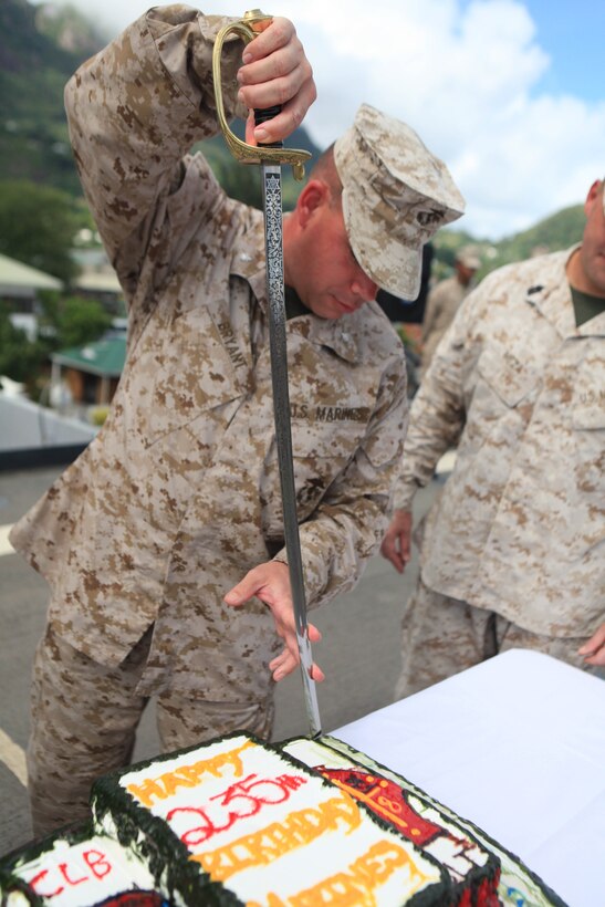 Lieutenant Colonel Timothy Bryant, the commanding officer of Combat Logistics Battalion 26, 26th Marine Expeditionary Unit cuts the Marine Corps birthday cake during a ceremony on the flight deck of USS Ponce, while in port in the Republic of Seychelles, Nov. 10. 2010. 26th MEU is currently embarked aboard the ships of Kearsarge Amphibious Ready Group operating in the 5th Fleet area of responsibility.