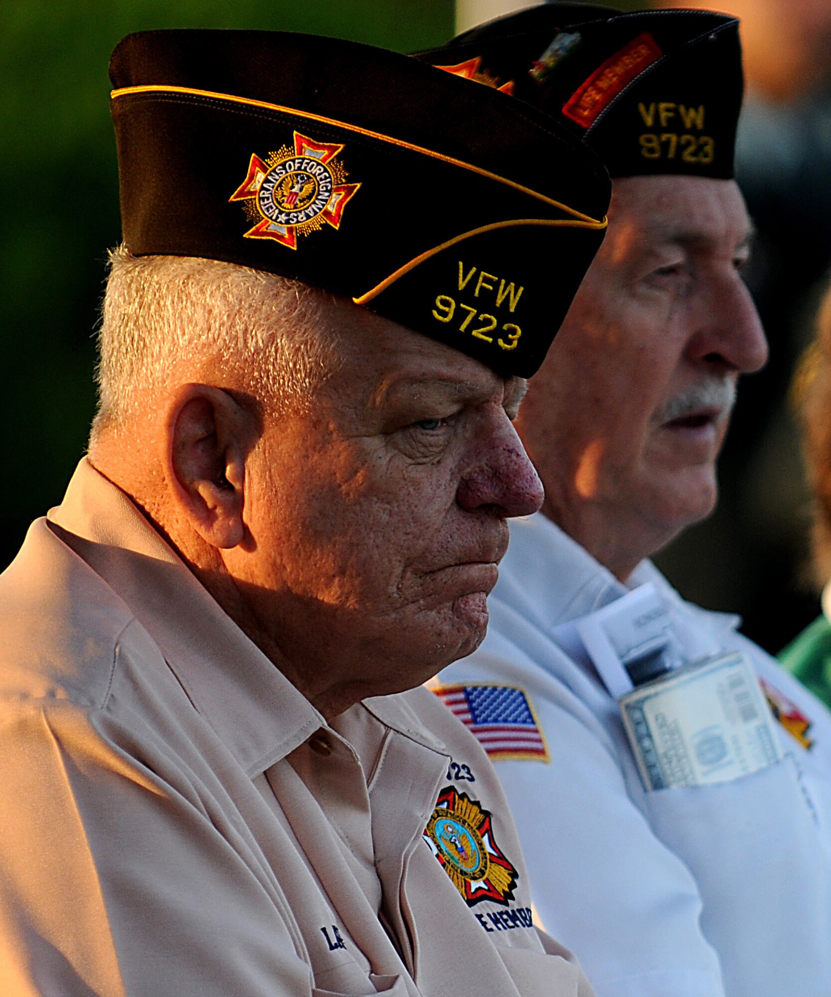 Larry Strain and Dennis Provencher, Members of the Veterans of Foreign Wars Pacific Post 9723, reflect solemnly during Kadena's Veterans Day observance Nov. 11. (U.S. Air Force Photo/Staff Sgt. Christopher Hummel)