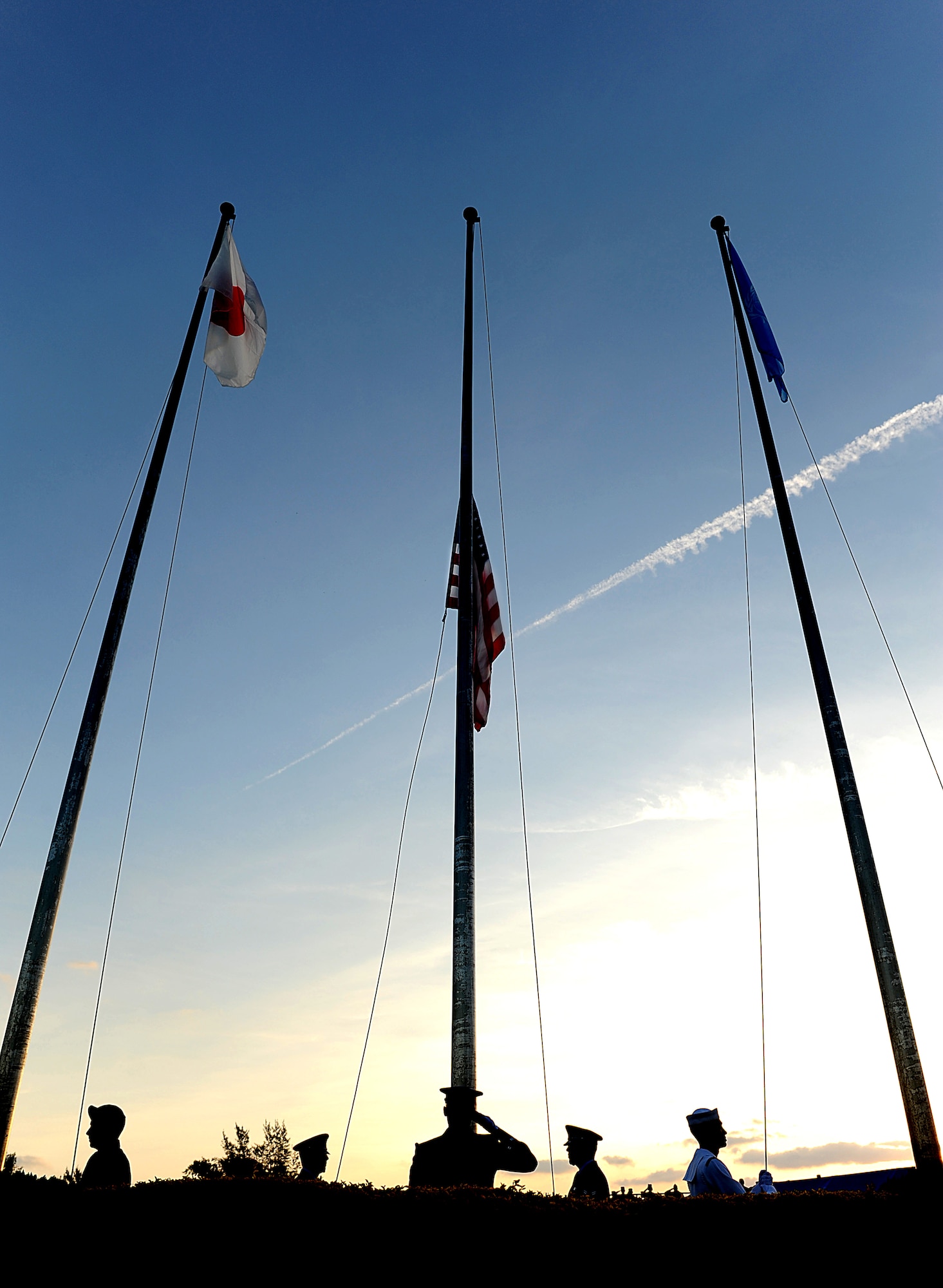 Soldiers, Sailors, Airmen, and Marines raise the flags at Kadena's Veterans Day ceremony Nov. 11. Veterans Day, formerly Armistice Day, was first observed Nov. 11, 1919, one year after fighting ceased for World War I, when President Woodrow Wilson proclaimed it as a day to be filled with "solemn pride in the heroism of those who died in the country's service". Brig. Gen. Ken Wilsbach, 18th Wing commander, referred to it as a day in which he is "so proud to be called a veteran." (U.S. Air Force Photo/Staff Sgt. Christopher Hummel)