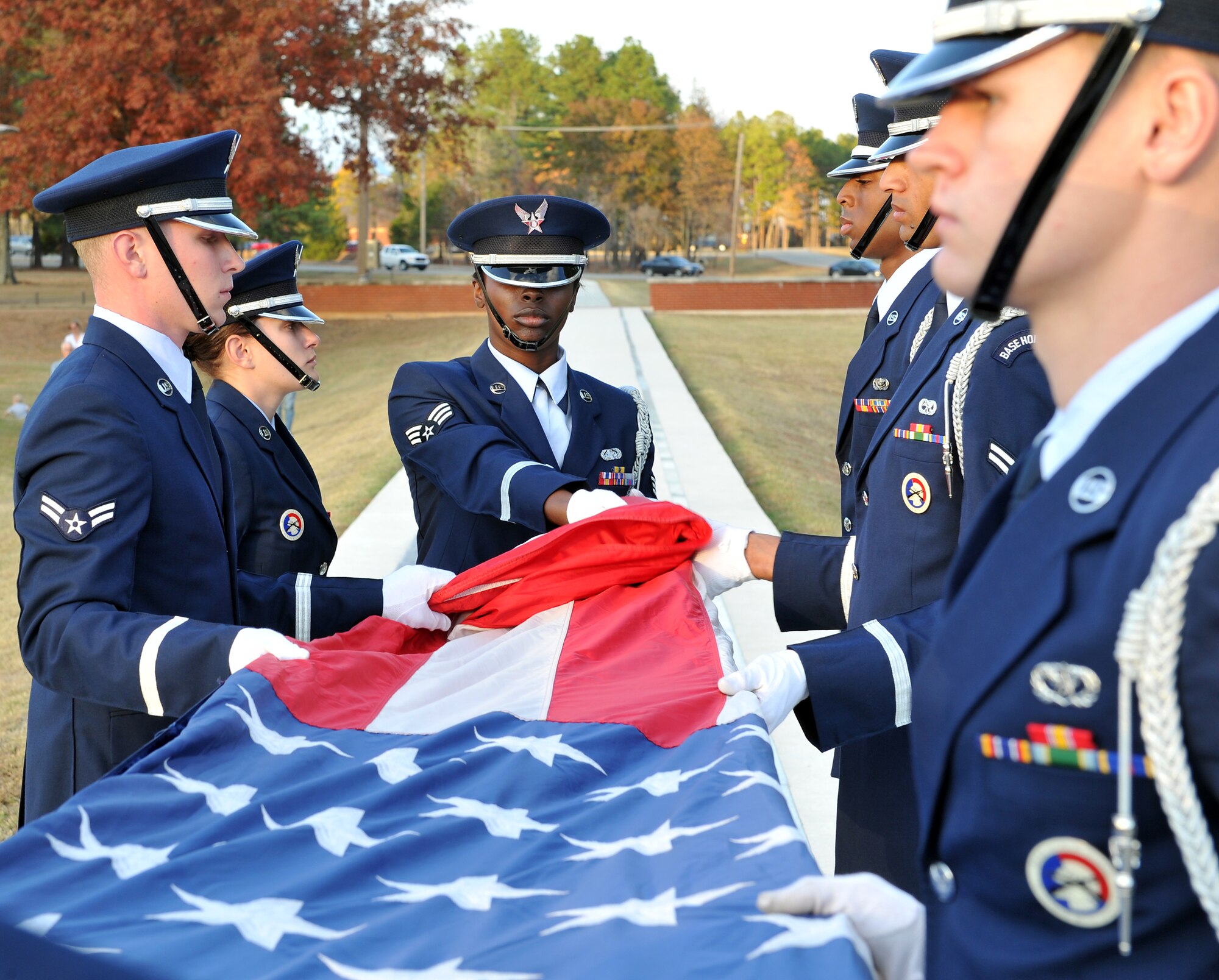 The base’s honor guard folds Old Glory at the Veterans Day retreat ceremony Nov. 10. (U.S. Air Force photo by Staff Sgt. Chris Willis)