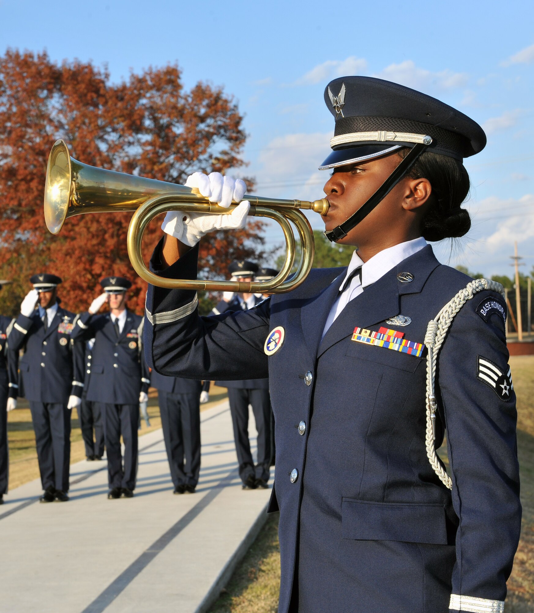 Senior Airman Massah Karmo, 19th Logistics Readiness Squadron, plays Taps on the bugle Nov. 10 during the Veterans Days retreat ceremony at Heritage Park. The retreat ceremony serves a two-fold purpose, signifying both the end of the official duty day, and providing an opportunity to pay respect to the nation’s flag.  (U.S. Air Force photo by Staff Sgt. Chris Willis)