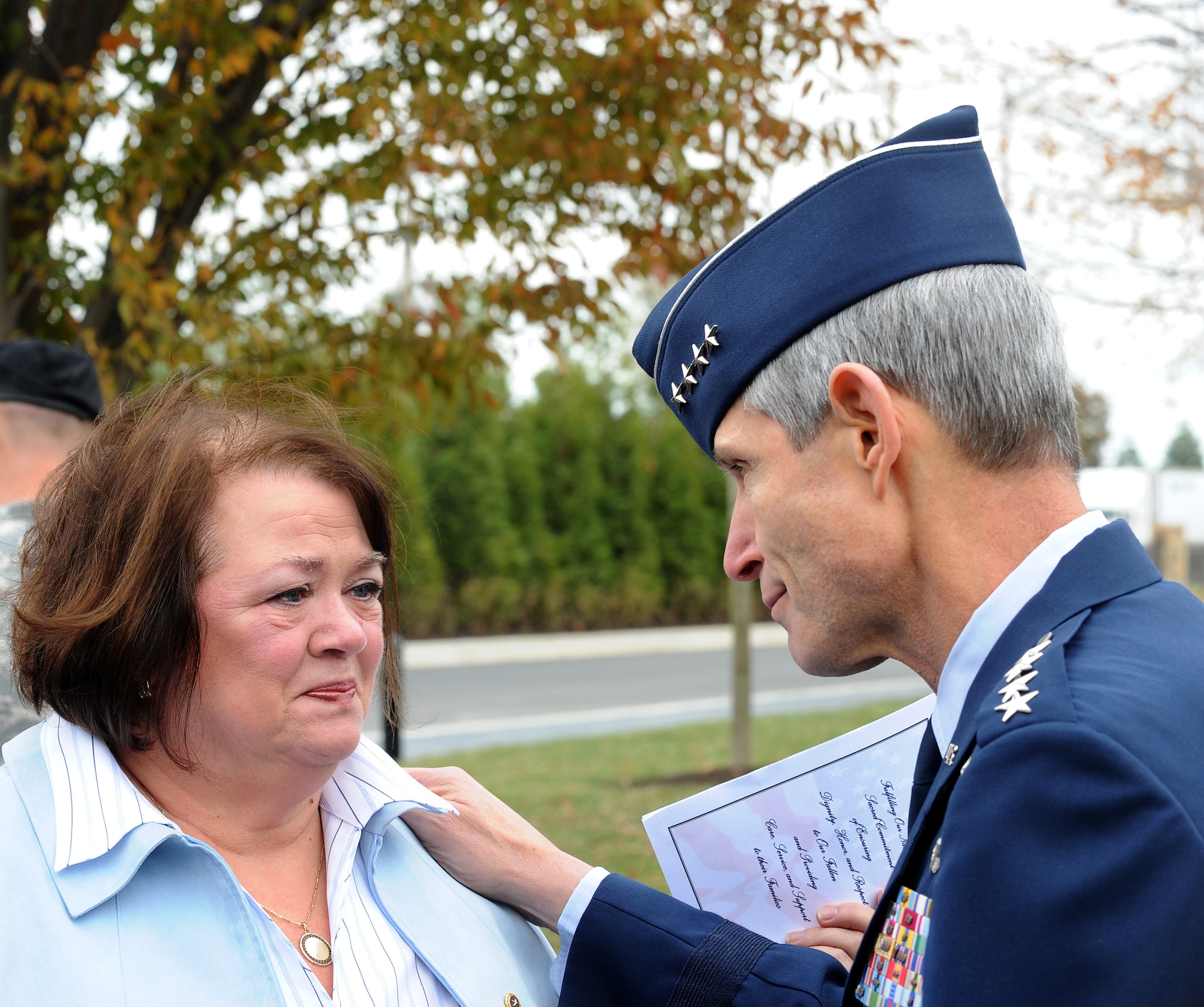 Air Force Chief of Staff Gen. Norton Schwartz consoles Judy Faunce of Wilmington, Del., following a dedication ceremony of the Fisher House for Families of the Fallen on Nov. 10, 2010, at Dover Air Force Base, Del.  Mrs. Faunce is the mother of U.S. Army Capt. Brian Faunce, who was killed in service in 2003.  The Fisher House Foundation built the 50th Fisher House at Dover to support families visiting the base for dignified transfers of their loved ones.  (U.S. Air Force photo/Scott M. Ash)