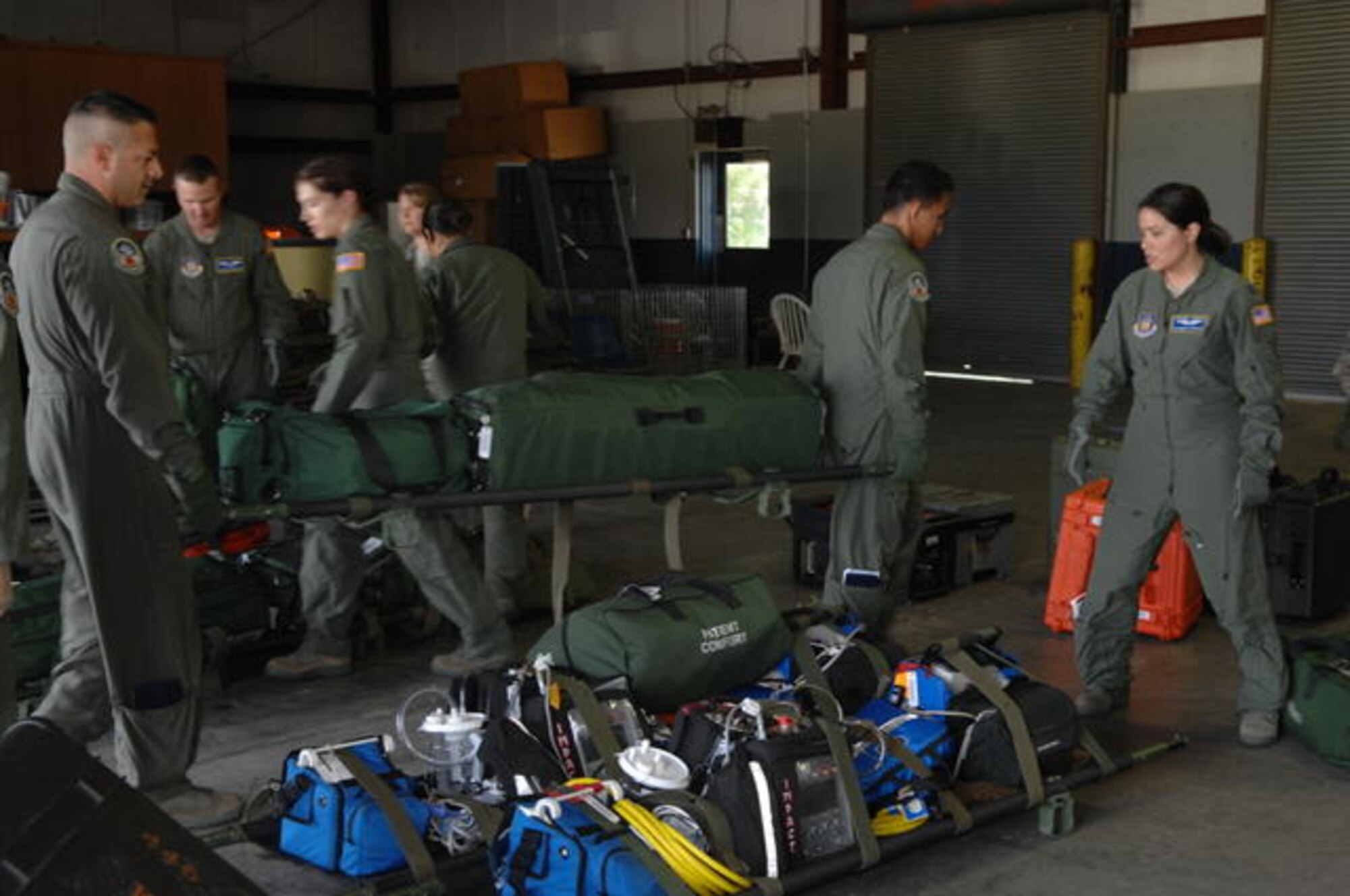 BUSH FIELD, Ga.- Airmen with the 446th Aeromedical Evacuation Squadron, Joint Base Lews-McChord, Wash., unload medical equipment as they gear up for Global Medic 2010. Global Medic, a joint field training exercise for theater aeromedical evacuation system and ground medical components, replicates all aspects of combat medical service support, allowing participating units to train as they fight. The squadron earned the Best Aeromedical Evacuation Squadron Award from Air Force Reserve Command this year. (U.S. Air Force photo by Staff Sgt. Donald R. Allen/Released)