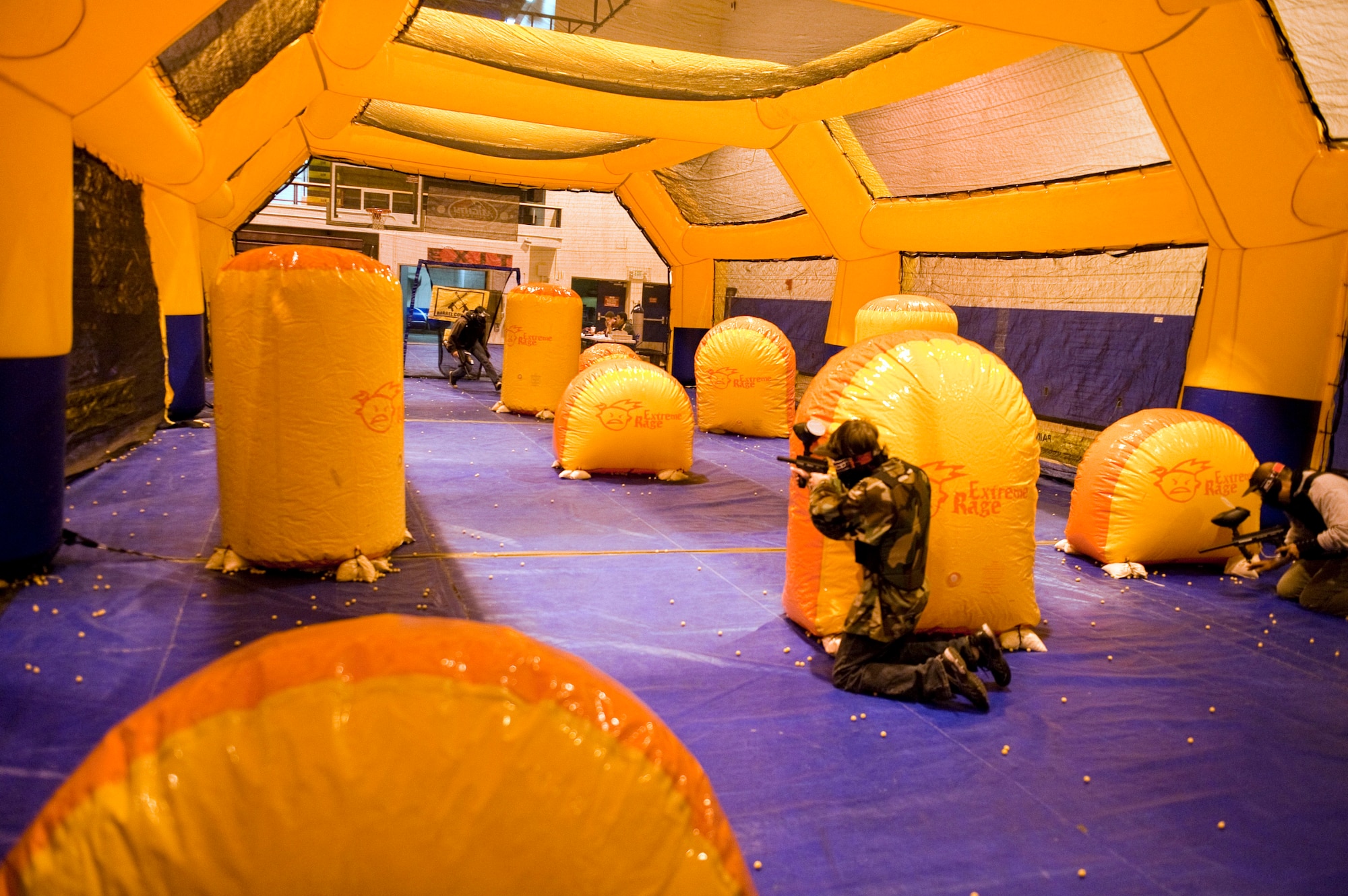 JOINT BASE ELMENDORF-RICHARDSON, Alaska, -- A group of family and friends plays speed ball at Buckner Gym on the Fort Richardson side of the installation Nov. 6.  The Warrior Extreme Paintball course is bringing speed ball, a paintball like sport which uses a softer ammunition that stays intact rather than paintballs, to the Buckner Gym on a trial basis.(U.S. Air Force photo/ Airman 1st Class Jack Sanders)