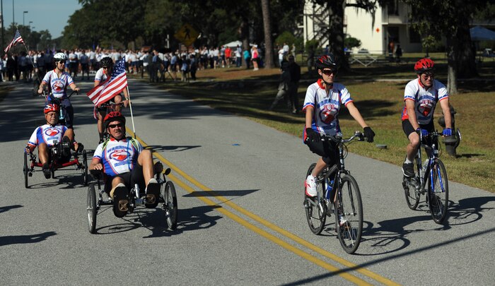 Wounded warriors kick off the second annual Run the Runway 5K event honoring Brig. Gen. (Ret.) Thomas Mikolajcik Nov. 10, 2010, on Joint Base Charleston, S.C. The group of wounded warriors included three Air Force members from the 1st Combat Camera Squadron, one Air Force retiree, one Navy retiree, two Army retirees and one retired Marine. Along with the wounded warriors, several hundred Joint Base Charleston members participated in the run which led through the base and onto the runway. (U.S. Air Force photo/Senior Airman Timothy Taylor)