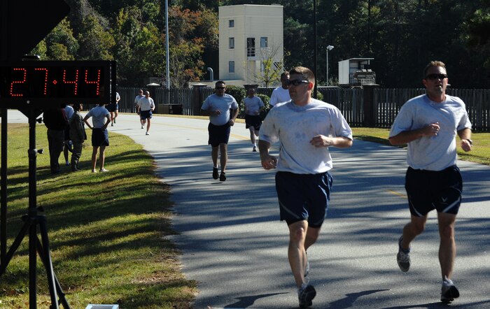 Joint Base Charleston members approach the finish line during the second annual  Run the Runway 5K event honoring Brig. Gen. (Ret.) Thomas Mikolajcik Nov. 10, 2010, on Joint Base Charleston, S.C. Hundreds of Joint Base members participated in the run which led through the base and onto the runway. (U.S. Air Force photo/Senior Airman Timothy Taylor)