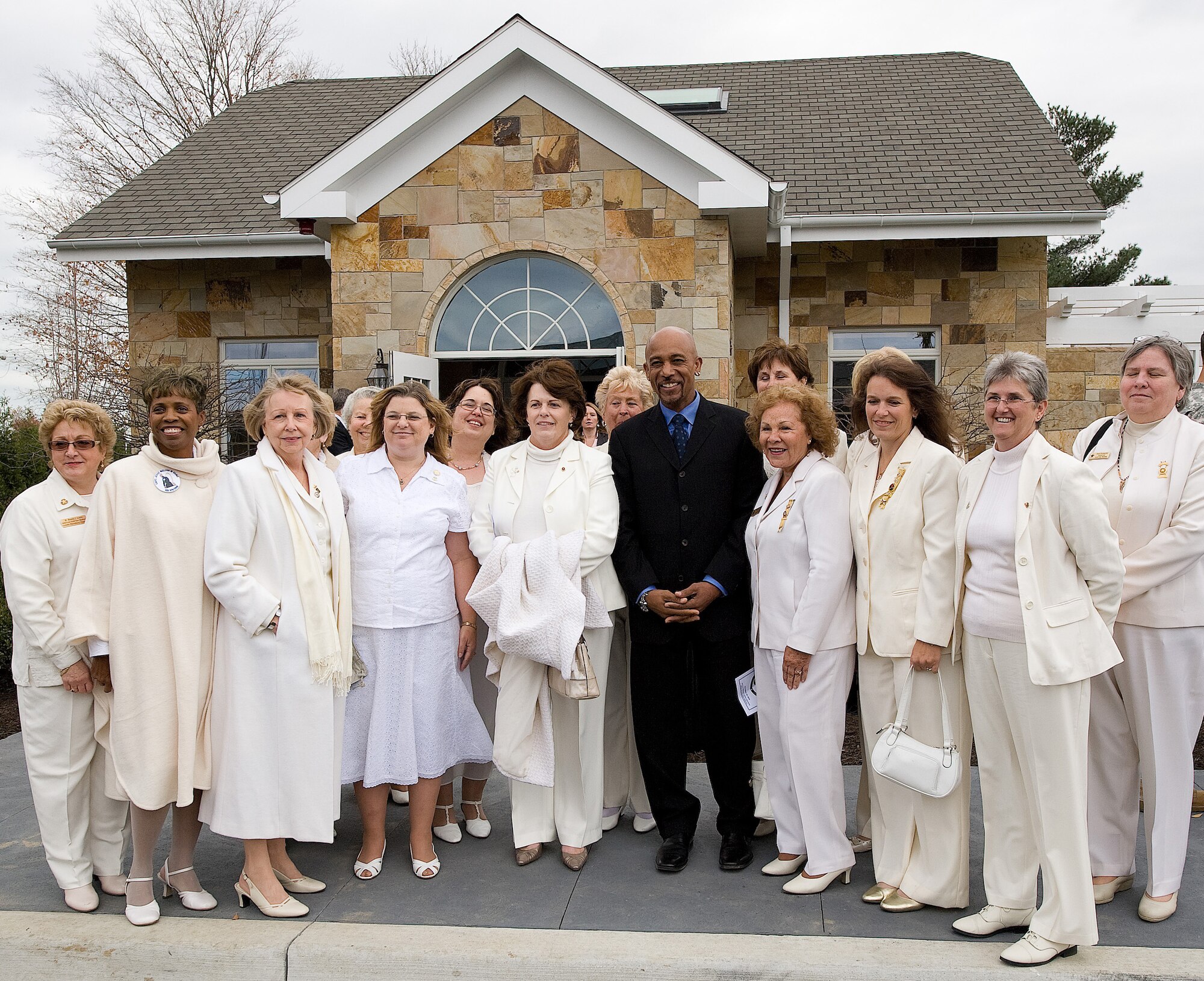 American Gold Star Mothers pose with Montel Williams in front of the Meditation Pavilion across from the new Fisher House for Families of the Fallen following a ribbon cutting ceremony Nov. 10, 2010. (U.S. Air Force photo/Jason Minto)