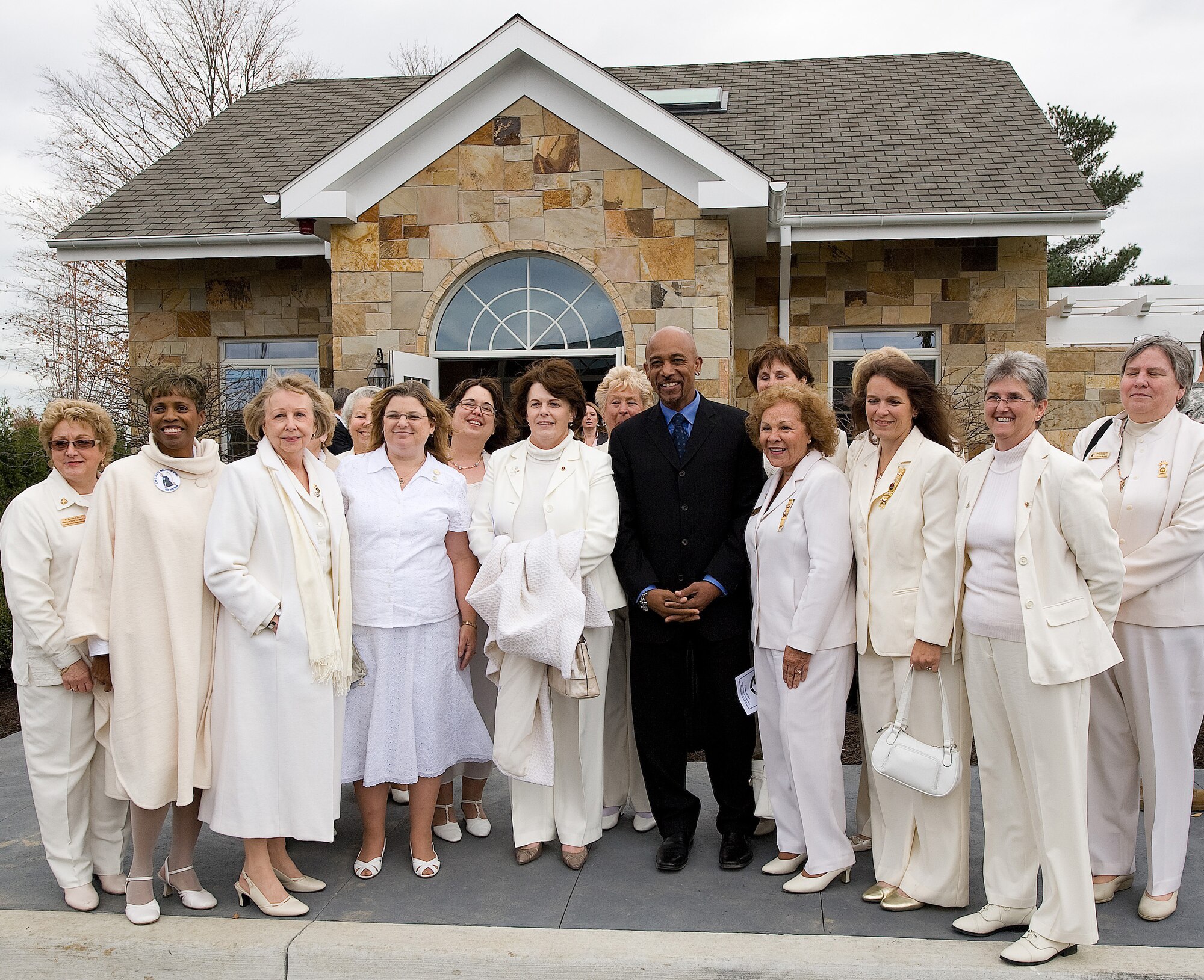 American Gold Star Mothers pose with Montel Williams in front of the Meditation Pavilion across from the new Fisher House for Families of the Fallen following a ribbon cutting ceremony Nov. 10, 2010. (U.S. Air Force photo/Jason Minto)