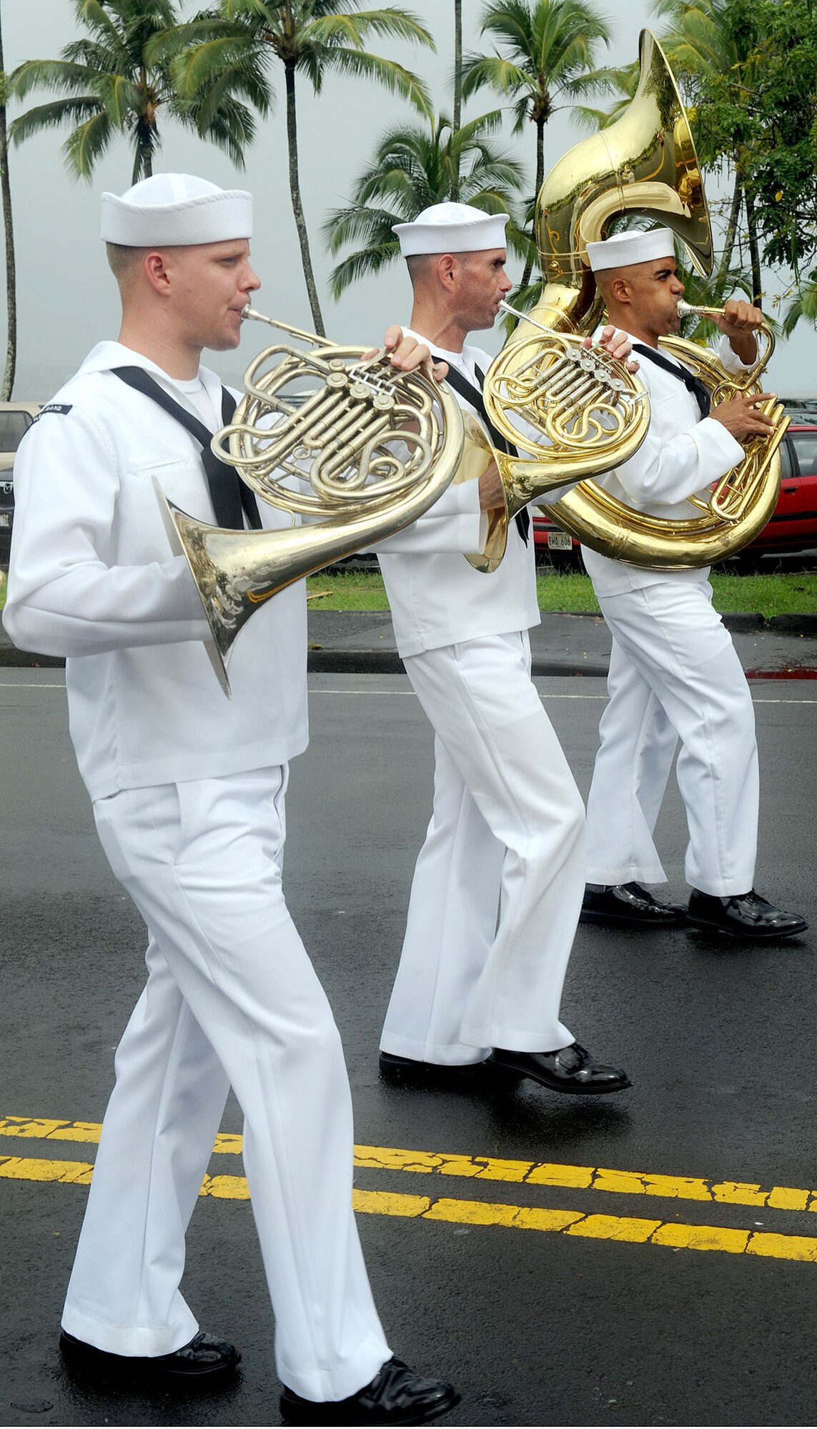 Sailors from the Naval Pacific Fleet Band perform during the 2010 Big Island Veterans Day Parade in Hilo, Hawaii, Nov. 6, 2010. City officials invited the National Security Agency/Central Security Service Joint Service Color Guard and the Naval Pacific Fleet Band to participate in the parade that day. (U.S. Air Force photo/Tech. Sgt. Jerome S. Tayborn)