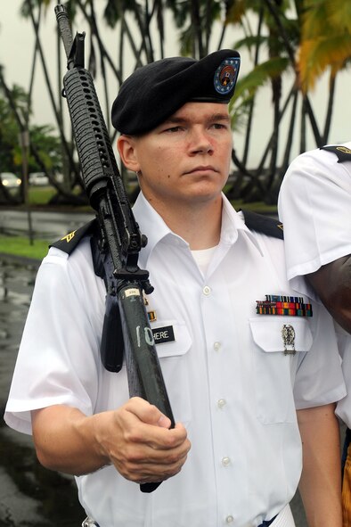 National Security Agency/Central Security Service Joint Service Color Guard Sergeant Timothy Godbehere marches in formation with his M-16 rifle in support of the 2010 Big Island Veterans Day Parade in Hilo, Hawaii, Nov. 6, 2010. City officials invited the National Security Agency/Central Security Service Joint Service Color Guard and the Naval Pacific Fleet Band to participate in the parade that day. (U.S. Air Force photo/Tech. Sgt. Jerome S. Tayborn)
