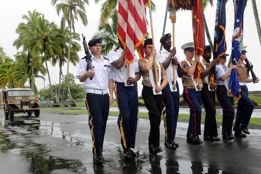The National Security Agency/Central Security Service Joint Service Color Guard leads the way for the 2010 Big Island Veteran?s Day Parade in Hilo, Hawaii, Nov. 6.  City officials invited the National Security Agency/Central Security Service Joint Service Color Guard and the Naval Pacific Fleet Band to participate in the parade that day. (U.S. Air Force photo/Tech. Sgt. Jerome S. Tayborn) 