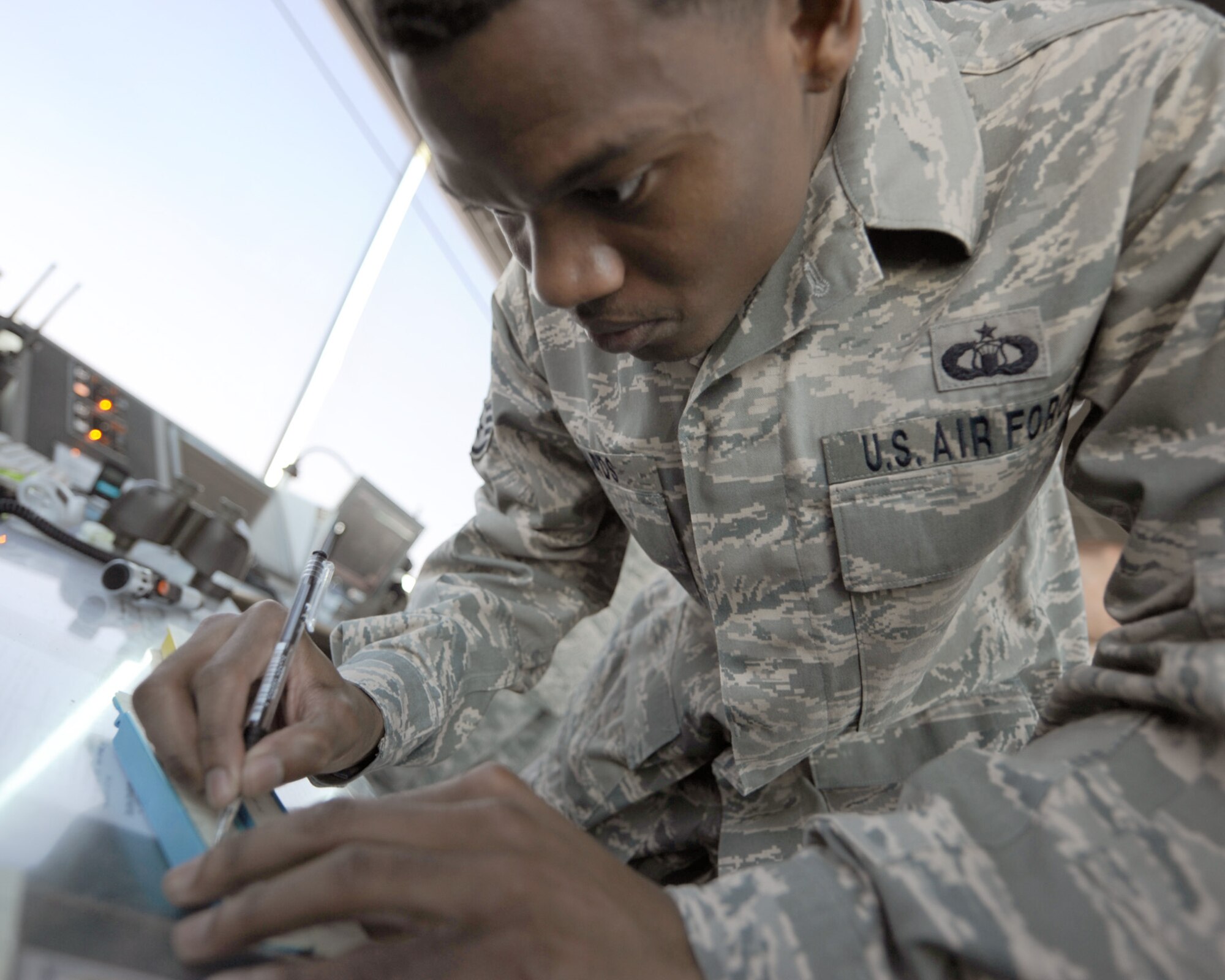 Staff Sgt. Tyrone Edwards documents arrival and departure times on a flight progress strip Oct. 18, 2010, at an undisclosed location in Southwest Asia. Sergeant Edwards is a local controller with the 379th Expeditionary Operations Support Squadron and is deployed from Keesler AFB, Miss. (U.S. Air Force photo/Senior Airman Katie Gieratz)