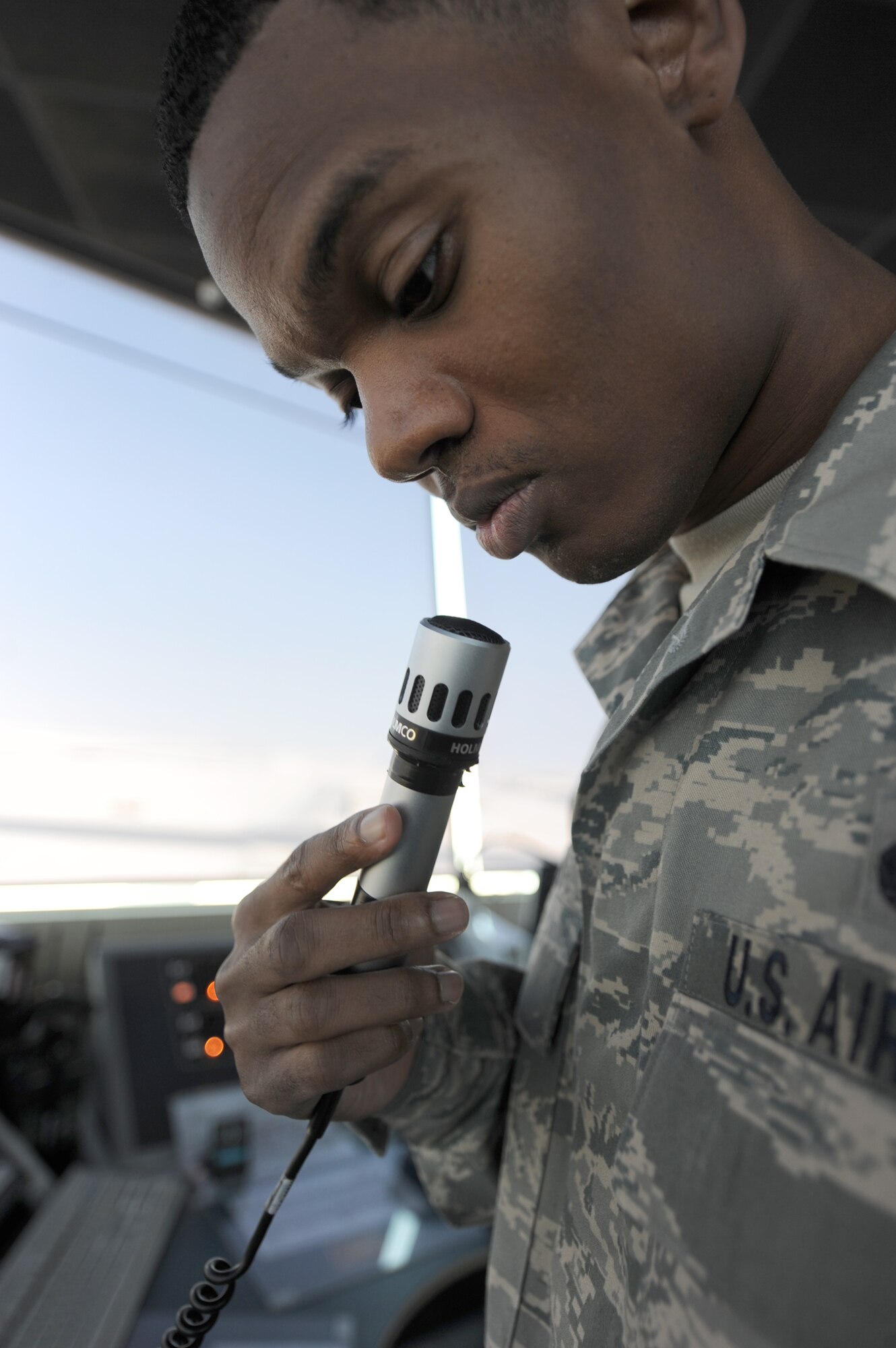 Staff Sgt. Tyrone Edwards clears an aircraft for take off Oct. 18, 2010, at an undisclosed location in Southwest Asia. Sergeant Edwards is a local controller with the 379th Expeditionary Operations Support Squadron and is deployed from Keesler AFB, Miss. (U.S. Air Force photo/Senior Airman Katie Gieratz)
