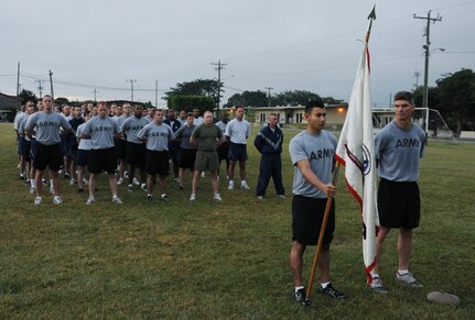 SOTO CANO AIR BASE, Honduras --  Standing at parade rest, the Army Forces waits for the Joint Task Force-Bravo Run to begin here Nov. 10. The two-mile monthly run brings all of JTF-Bravo together to run in formation. (U.S. Air Force photo/Tech. Sgt. Benjamin Rojek)