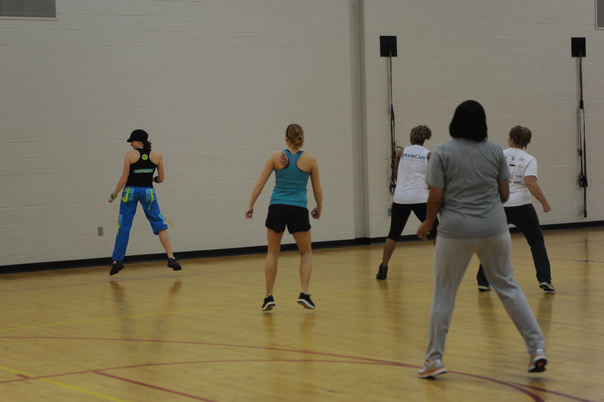 MINOT AIR FORCE BASE, N.D. -- Class instructor, Vanessa Kimball, wife of Capt. Dan Kimball, 23rd Bomb Squadron electronic warfare officer, motivates her Zumba class during the Aerobathon at the McAdoo Sports and Fitness Center here Nov 6. The 5th Force Support Squadron created the Aerobathon to introduce a variety of aerobic classes offered to base personnel. (U.S. Air Force photo/Airman 1st Class Aaron-Forrest Wainwright)