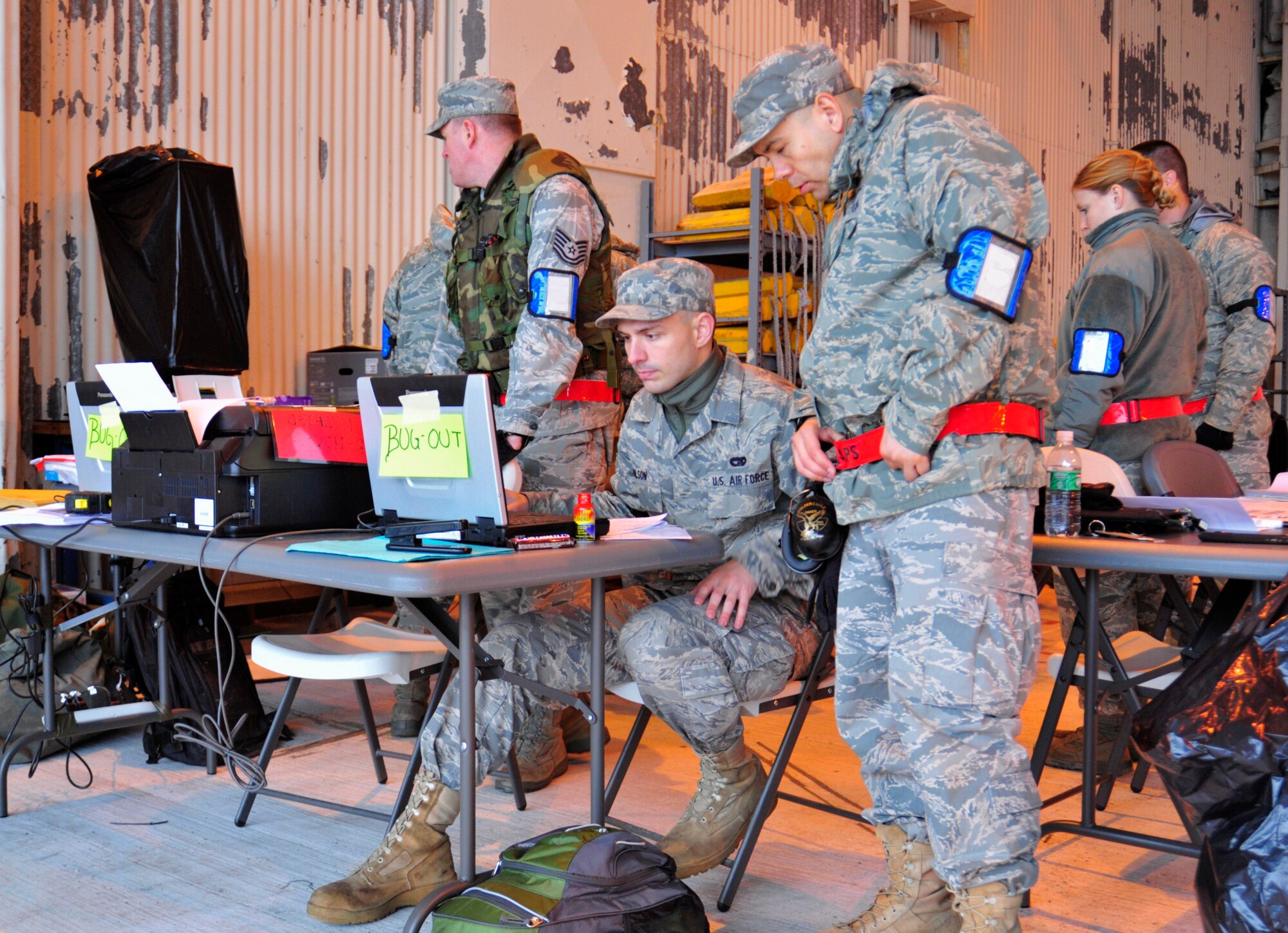 Airmen from the 62nd Aerial Port Squadron work together to develop a redeployment roster during a mobility exercise Nov. 9 at McChord Field, Joint Base Lewis-McChord, Wash. The MOBEX tests Team McChord’s ability to deploy, survive and operate in a combat environment and return home. (U.S. Air Force photo/Adamarie Lewis-Page)