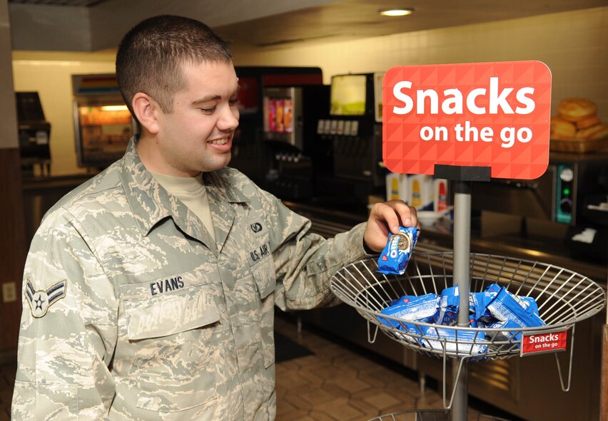 Airman 1st Class Shaun Evans, 2nd Operational Support Squadron, picks out a snack at the Red River Dining Facility on Barksdale Air Force Base, La., Nov. 10. The dining facility now allows Airmen the option of getting their food to-go as long as they are on a meal card. (U.S. Air Force photo/Airman 1st Class Sean Martin)(Released)