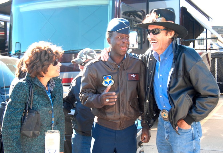 Lt. Gen. Edward A. Rice Jr., incoming commander of Air Education and Training Command, and his wife, Teresa, speak with NASCAR legend Richard Petty at the Texas Motor Speedway Nov. 7, 2010, before the NASCAR Sprint Cup Series race.  The general, who has been confirmed for his fourth star, conducted a swearing-in ceremony for Delayed Enlistment Program members, and met members of the Air Force's No. 19 NASCAR team. (U.S. Air Force photo/Steven McCray)