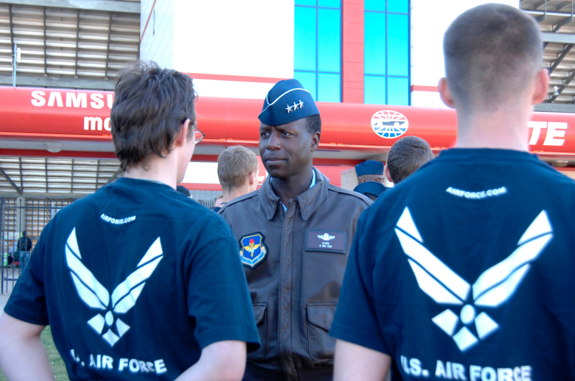 Lt. Gen. Edward A. Rice Jr., incoming commander of Air Education and Training Command, chats with Delayed Enlistment Program members at Texas Motor Speedway Nov. 7, 2010, before the NASCAR Sprint Cup Series race. The general, who has been confirmed for his fourth star, conducted the DEP swearing-in ceremony in front of thousands of NASCAR fans before the start of the race. (U.S. Air Force photo/Steven McCray)
