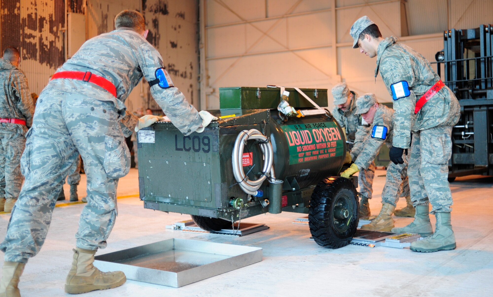 Airmen from the 62nd Aerial Port Squadron move equipment during a mobility exercise Nov. 9 at McChord Field, Joint Base Lewis-McChord, Wash. A MOBEX is key to ensuring every deployment is a success and requires hours of work and collaboration from Team McChord.(U.S. Air Force photo/Amn Leah Young)
