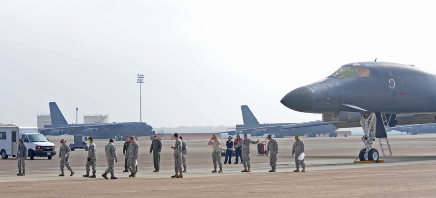 Members from the 28th Aircraft Maintenance Squadron from Ellsworth Air Force Base, S.D., perform a foreign object disposal walk on Barksdale AFB, La. Nov. 9, before the aircraft takes off during Green Flag East Exercise. This is the first time the B-1B Lancer participated in the GFE Exercise. (U.S. Air Force photo/Senior Airman Alexandra M. Boutte)