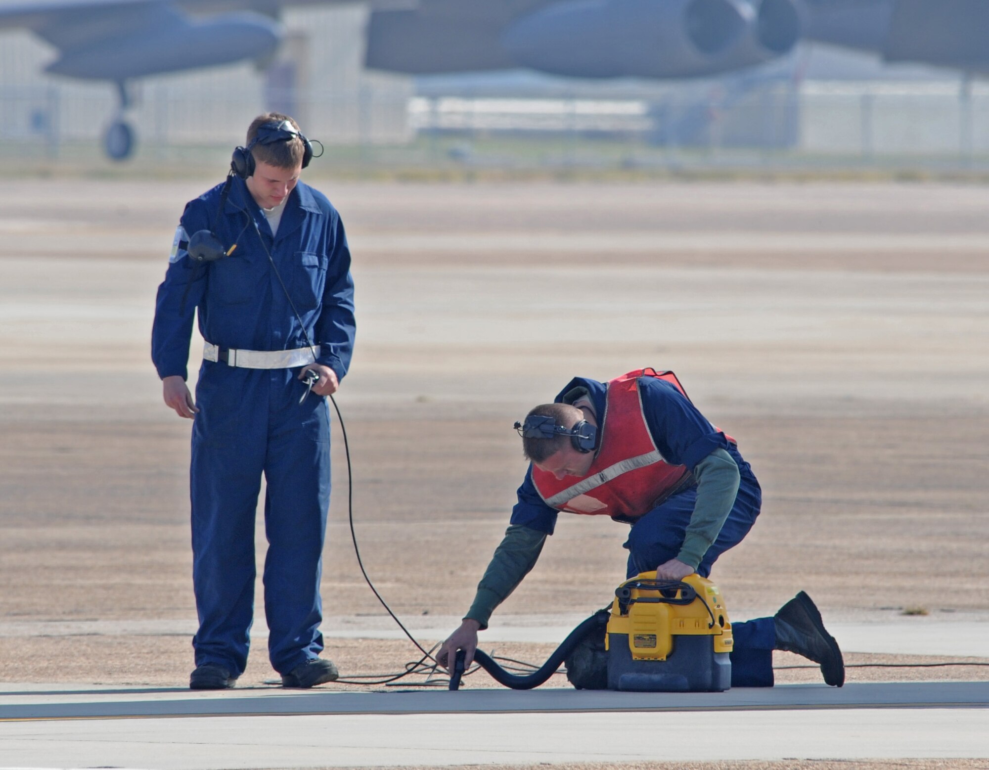 Airman 1st Class?s David Shelby and Max McGee, 28th Aircraft Maintenance Squadron from Ellsworth Air Force Base, S.D., prepare to ground the B-1B Lancer on Barksdale AFB, La., Nov. 9 during Green Flag East Exercise. This is the first time the B-1B Lancer aircraft was used in the exercise. (U.S. Air Force photo/Senior Airman Alexandra M. Boutte)