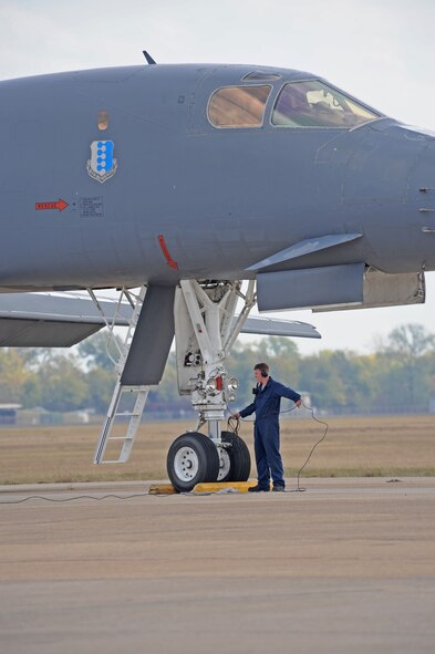Airman 1st Class Max McGee, 28th Aircraft Maintenance Squadron from Ellsworth Air Force Base, S.D., coils the brake cord from the B-1B Lancer at Barksdale AFB, La. Nov. 9. Approximately 75 aircrew and ground maintenance members and four B-1B Lancer aircrafts are participating in the Green Flag East Exercise ending Nov. 22. (U.S. Air Force photo/Senior Airman Alexandra M. Boutte)