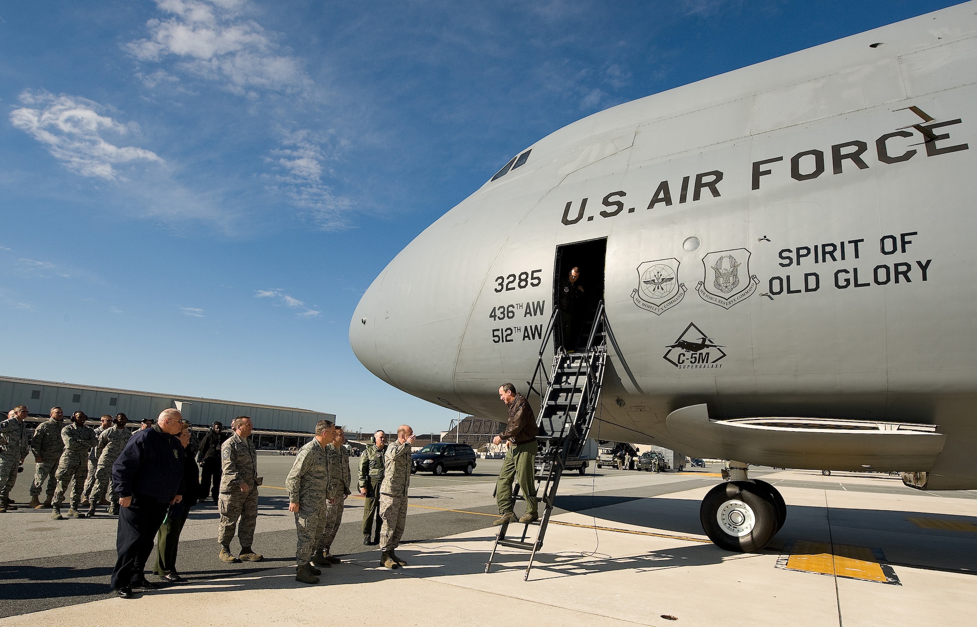 Team Dover leadership greet Gen. Raymond Johns, Air Mobility Command commander, as he delivers the first production C-5M Super Galaxy to the 436th Airlift Wing at Dover Air Force Base, Del.  The Spirit of Old Glory is the fourth C-5M delivered to Dover, after undergoing a modernization program to improve the reliability, efficiency, maintainability and availability of the heavy strategic lift aircraft.  (U.S. Air Force photo/Jason Minto Released)
