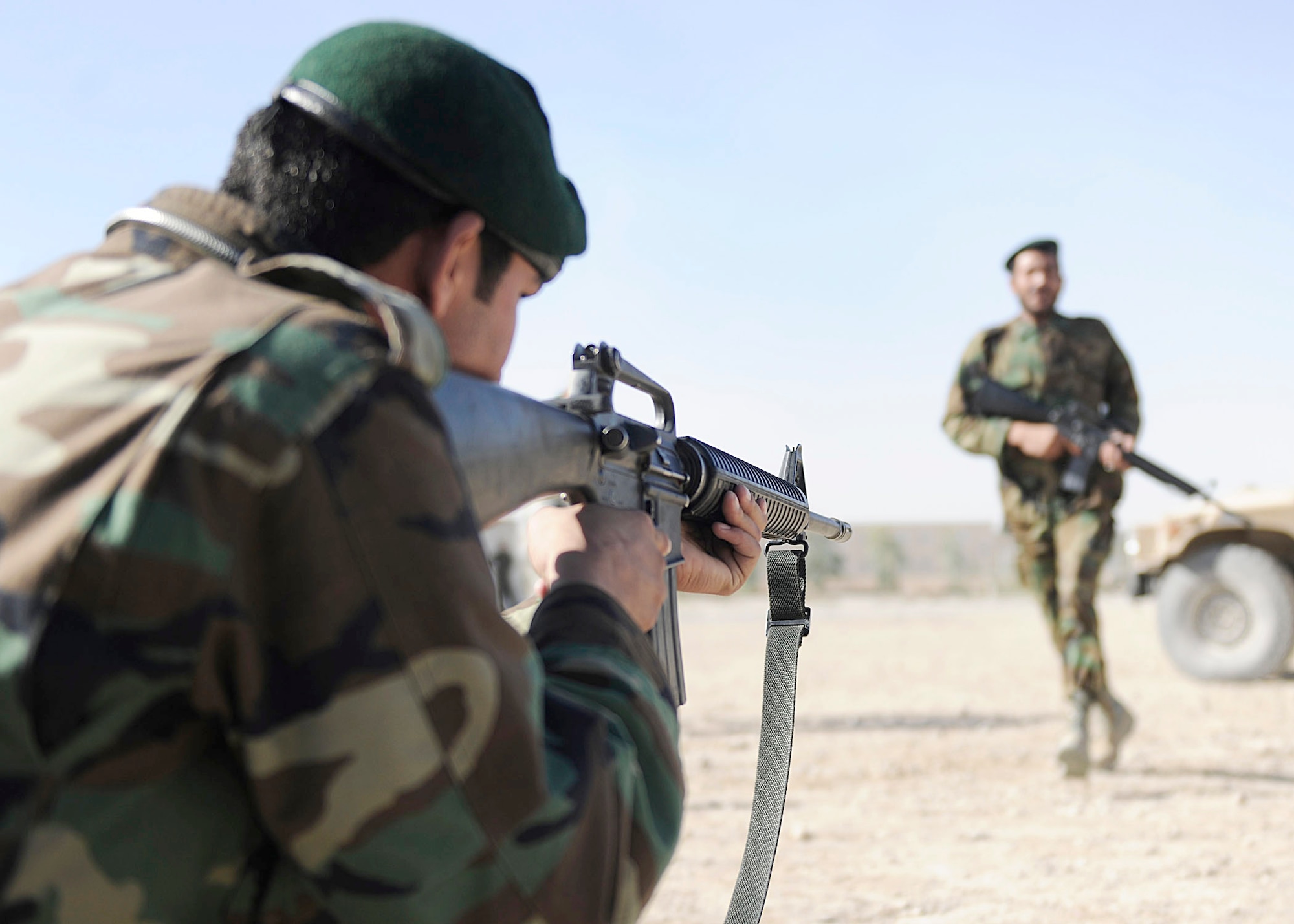 Afghan air force members from the Kandahar Air Wing Security Kandak practice dismounted Humvee operations at Kandahar Airfield, Afghanistan, Nov. 7, 2010. Air Force members from the 443rd Air Expeditionary Advisory Squadron have been mentoring Afghan soldiers on techniques and tactics of becoming part of a quick-response force. (U.S. Air Force photo/Senior Airman John D. Strong II)