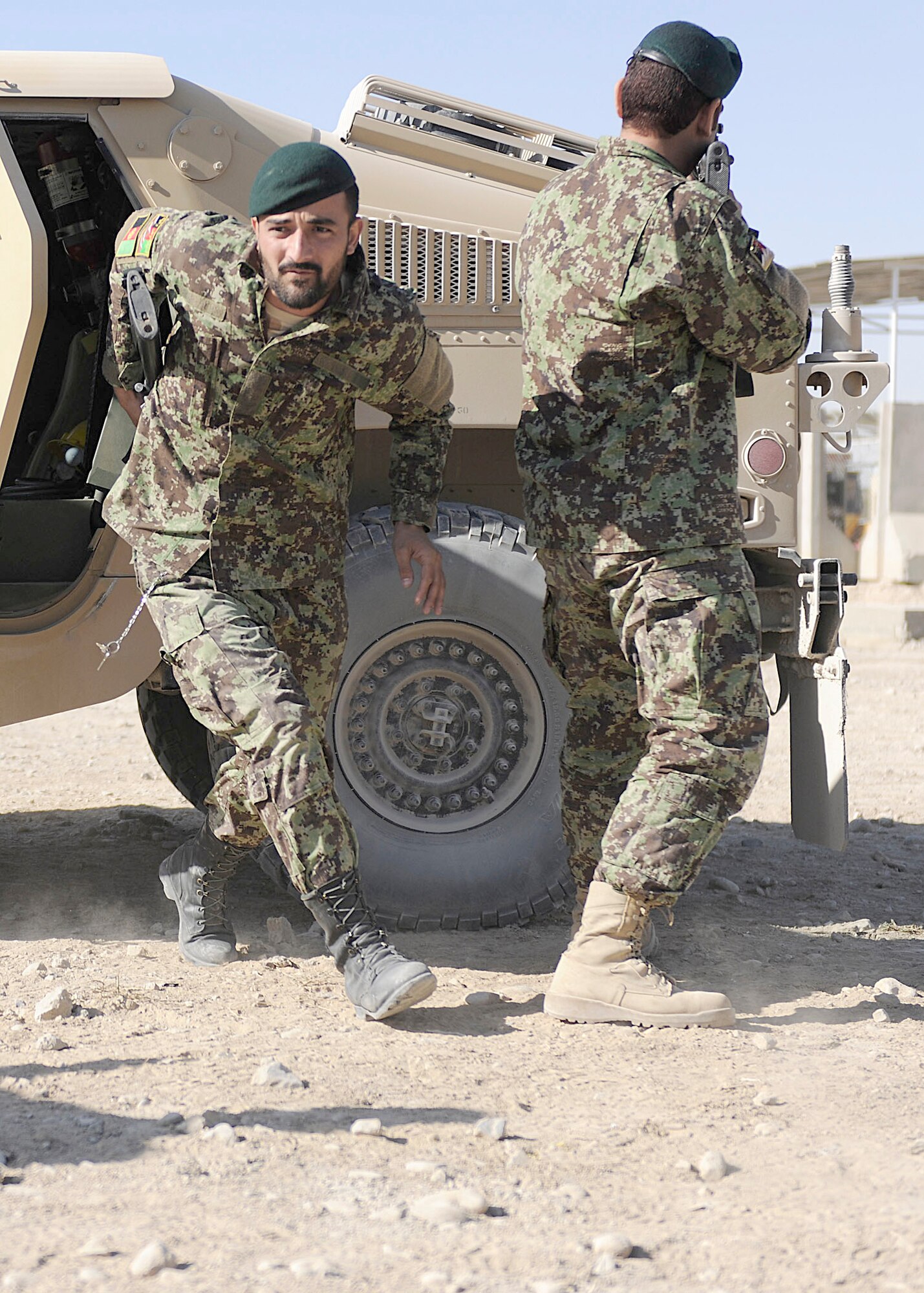 A member of the Afghan Air Force Kandahar Air Wing Security Kandak exits a Humvee during a training session Nov. 7, 2010, at Kandahar Airfield. The soldiers practiced their Humvee driving skills and dismount procedures after attending a month-long training session taught by 443rd Air Expeditionary Advisory Squadron members. (U.S. Air Force photo/Senior Airman John D. Strong II) 