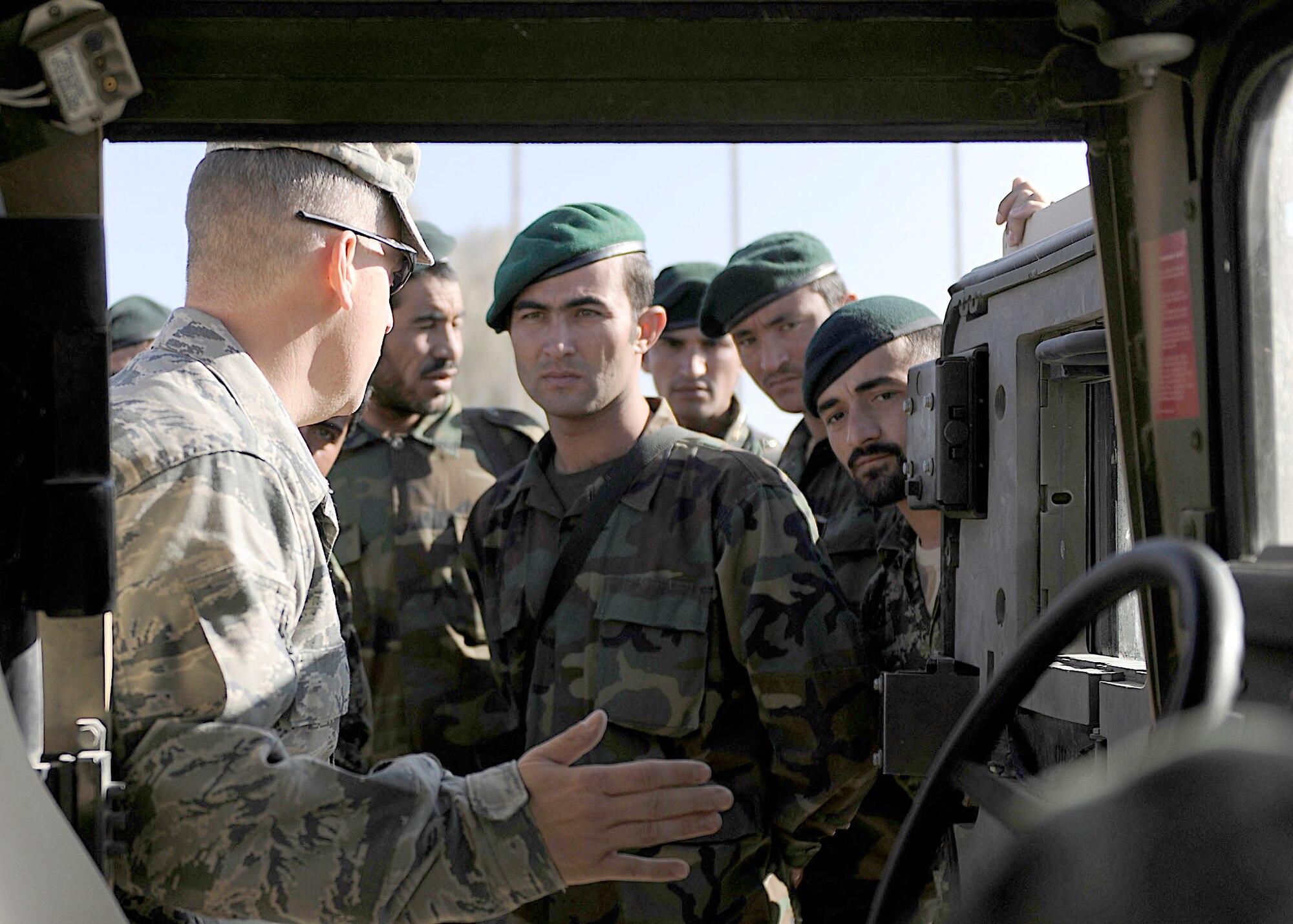 Tech. Sgt. Michael Smith instructs a group of Afghan air force members during a training session Nov. 7, 2010, at Kandahar Airfield, Afghanistan. The AAF members belong to the Kandahar Air Wing Security Kandak and are training to become an elite quick-response force. Sergeant Smith is a member of the 443rd Air Expeditionary Advisory Squadron/NATO Training Mission - Afghanistan. (U.S. Air Force photo/Senior Airman John D. Strong II)
