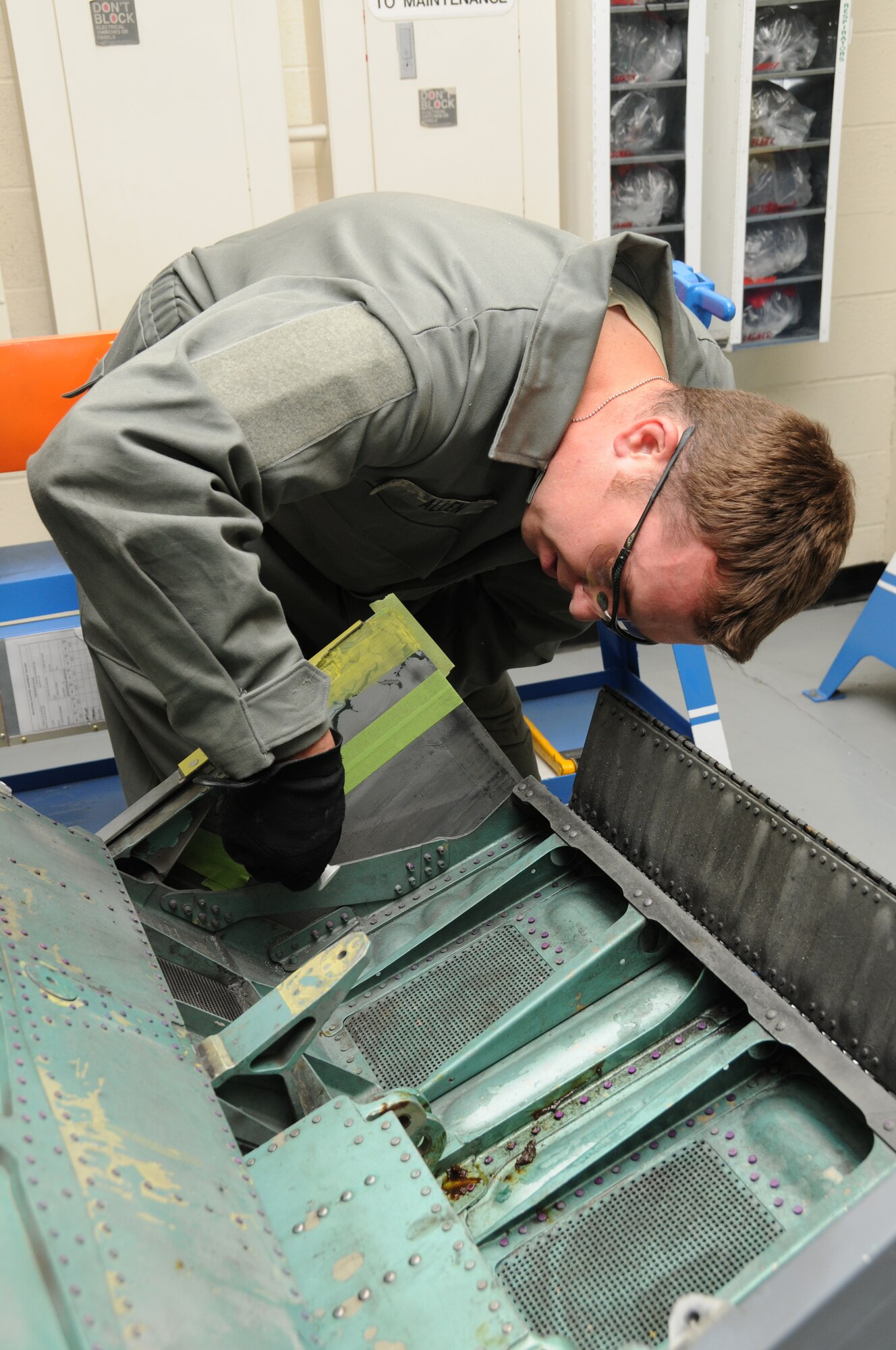 Staff Sergeant Paul Allen, 173rd Fighter Wing Structural Maintenance shop, lays down a coat of paint primer on an F-15 part at Kingsley Field, Ore., October 28, 2010.  (U.S. Air Force photo by Senior Airman Bryan Nealy) Released 
