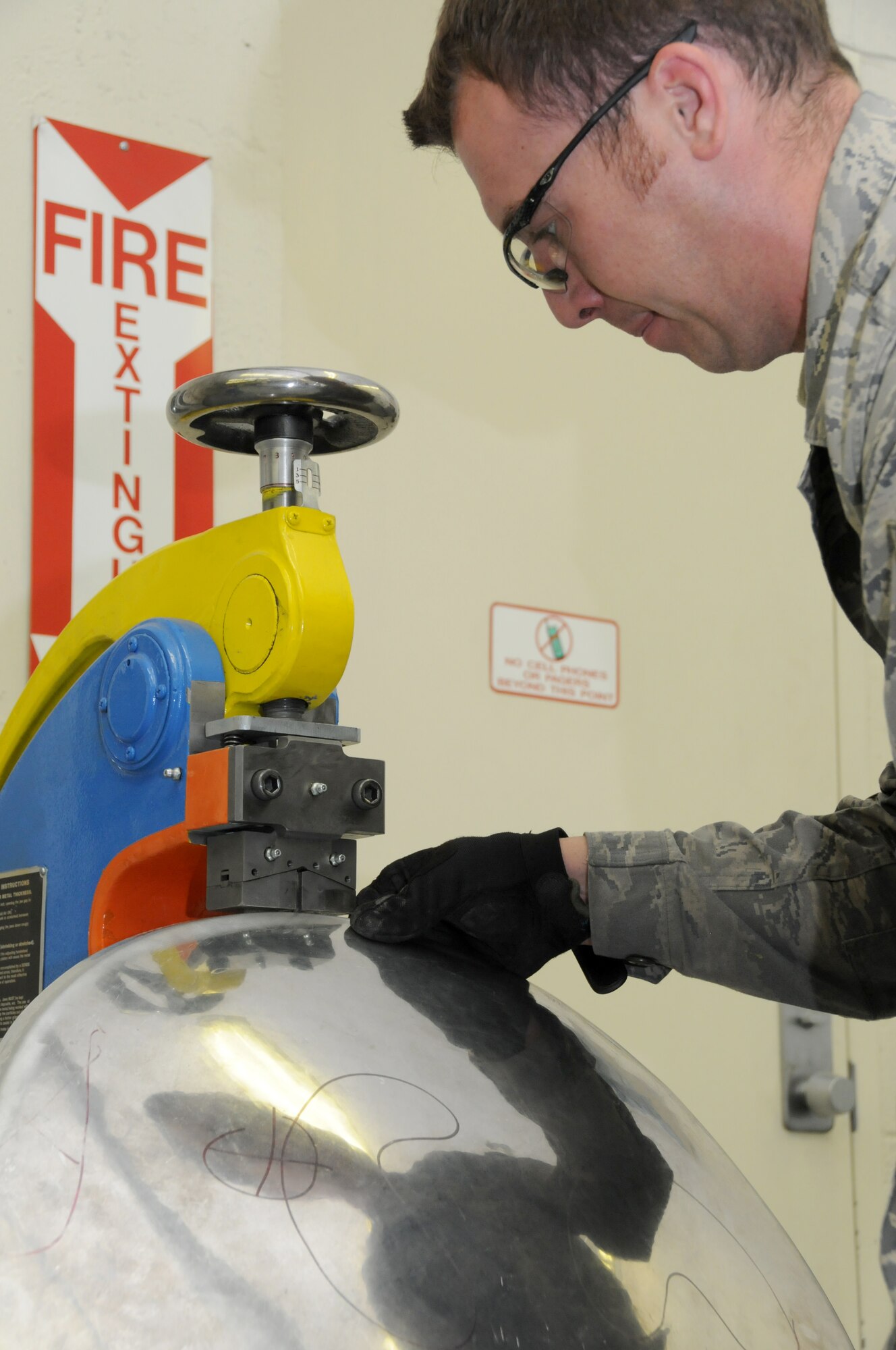 Staff Sergeant Paul Allen, 173rd Fighter Wing Structural Maintenance shop, flattens the edge of a piece of sheet metal at Kingsley Field, Ore., October 28, 2010.  (U.S. Air Force photo by Senior Airman Bryan Nealy) Released 
