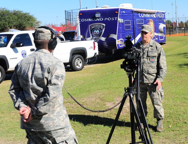 101109-F-8454M-327
SHAW AIR FORCE BASE S.C.-- Senior Airman Christopher Beaver, 20th Fighter Wing public affairs broadcaster, interviews Tech. Sgt. Aaron Bunyea, 20th Civil Engineering Squadron, after the Major Accident Response Exercise Nov. 9. The MARE trains first responders how to best respond if a major accident was to occur. (U.S. Air Force Photo/Senior Airman David L. Minor)