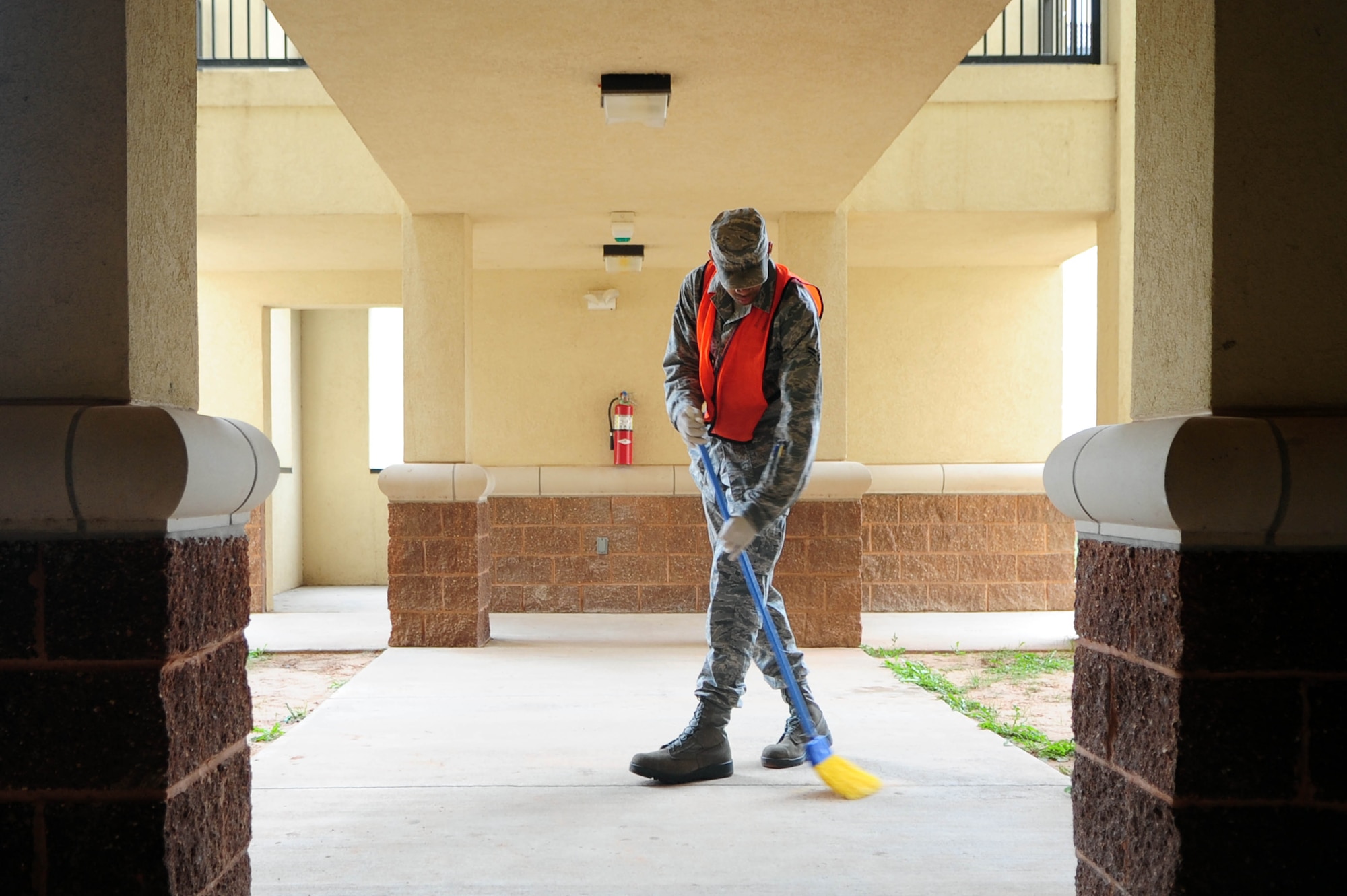 Airman 1st Class Jonathan Lowe, 2nd Maintenance Group, sweeps the corridors of the dormitories as part of his bay orderly duties at Barksdale Air Force Base, La., Nov. 9. Bay orderly is performed each week by airmen who live in the dorms; they ensure dormitory common areas stay clean and free of clutter. (U.S. Air Force photo/Senior Airman Joanna M. Kresge)