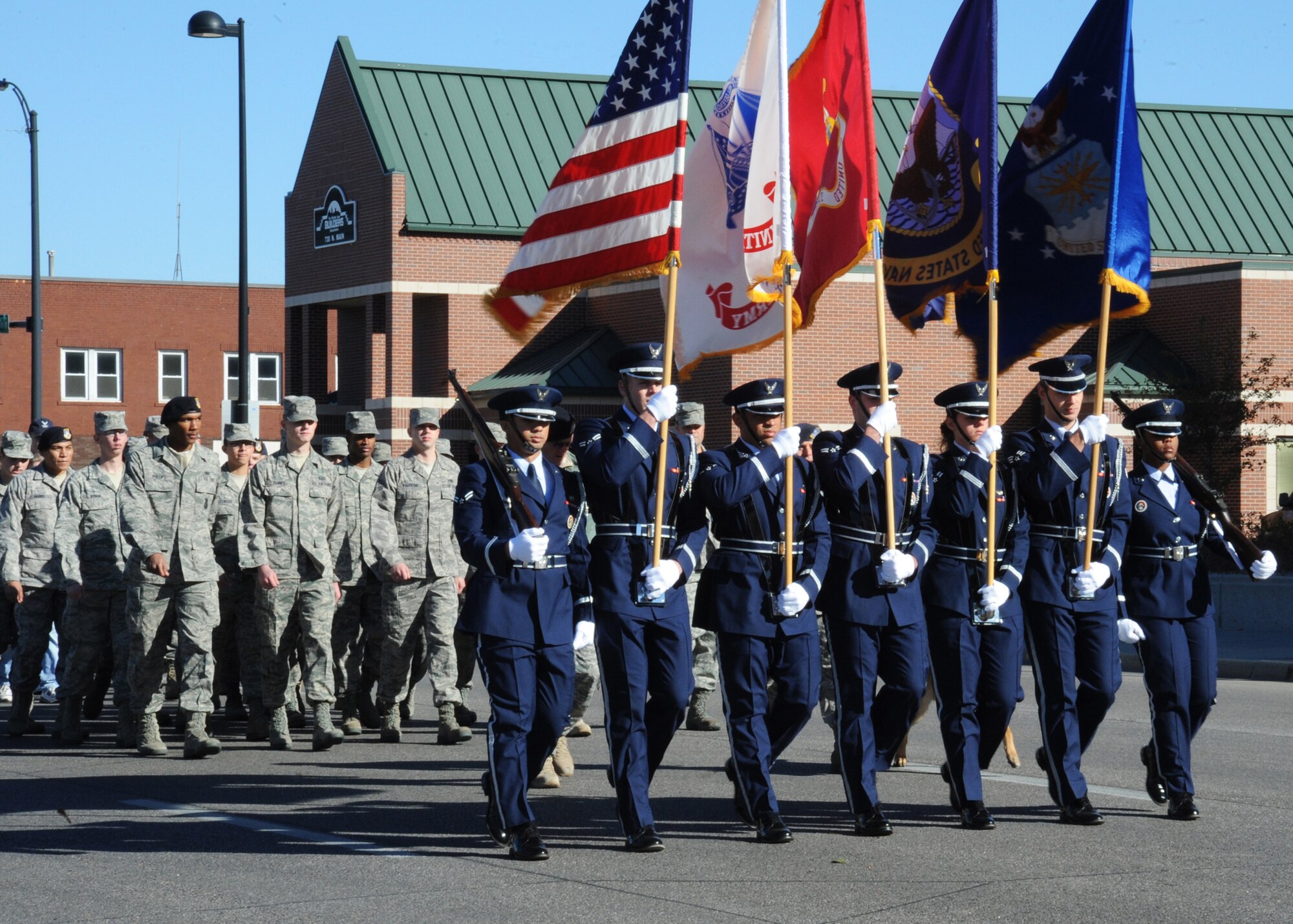 Lead by the McConnell Air Force Base Honor Guard, First Term Airman’s Center students march in Wichita’s Veterans Day parade held on Nov. 6, 2010, Wichita, Kan. Although the parade took place on Nov. 6, Veterans Day is nationally observed on Nov. 11. (U.S. Air Force photo/Airman 1st Class Katrina M. Brisbin)