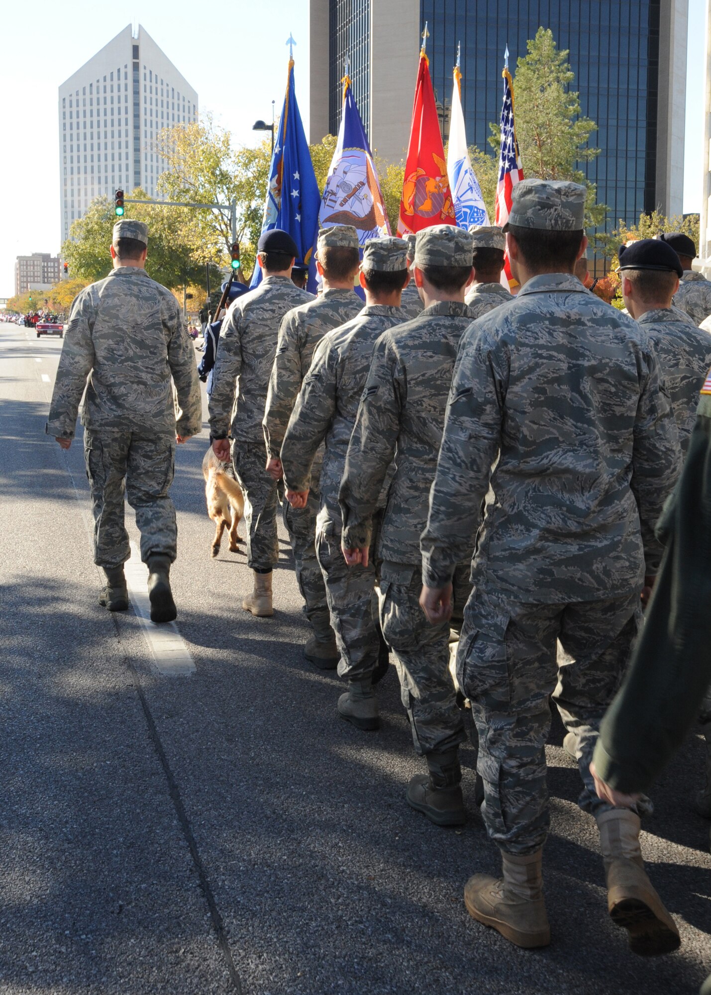 Lead by McConnell’s Honor Guard, First Term Airman’s Center students march in Wichita’s Veterans Day parade Nov. 6, 2010, Wichita, Kan. Several hundred people gathered along Wichita’s Main Street to show their support for veterans and active duty service memebers. (U.S. Air Force photo/Airman 1st Class Katrina M. Brisbin)