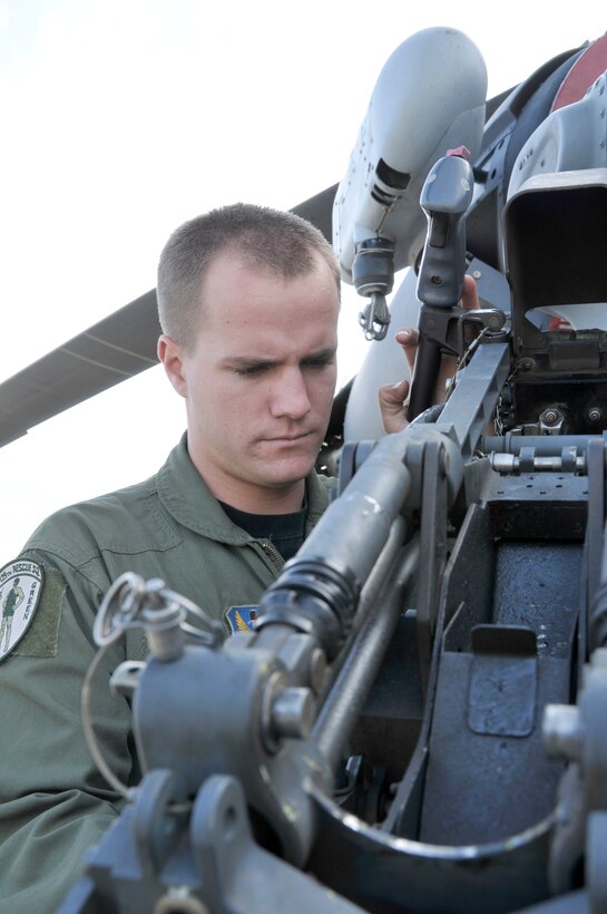 Senior Airman Jacob Ellwood checks all systems as he readies a HH-60G Pave Hawk helicopter for a mission Nov. 6, 2010, at Moffett Federal Airfield, Calif. Airman Ellwood is a flight engineer assigned to the California Air National Guard's 129th Rescue Squadron. (U.S. Air Force photo/Staff Sgt. Kim E. Ramirez)