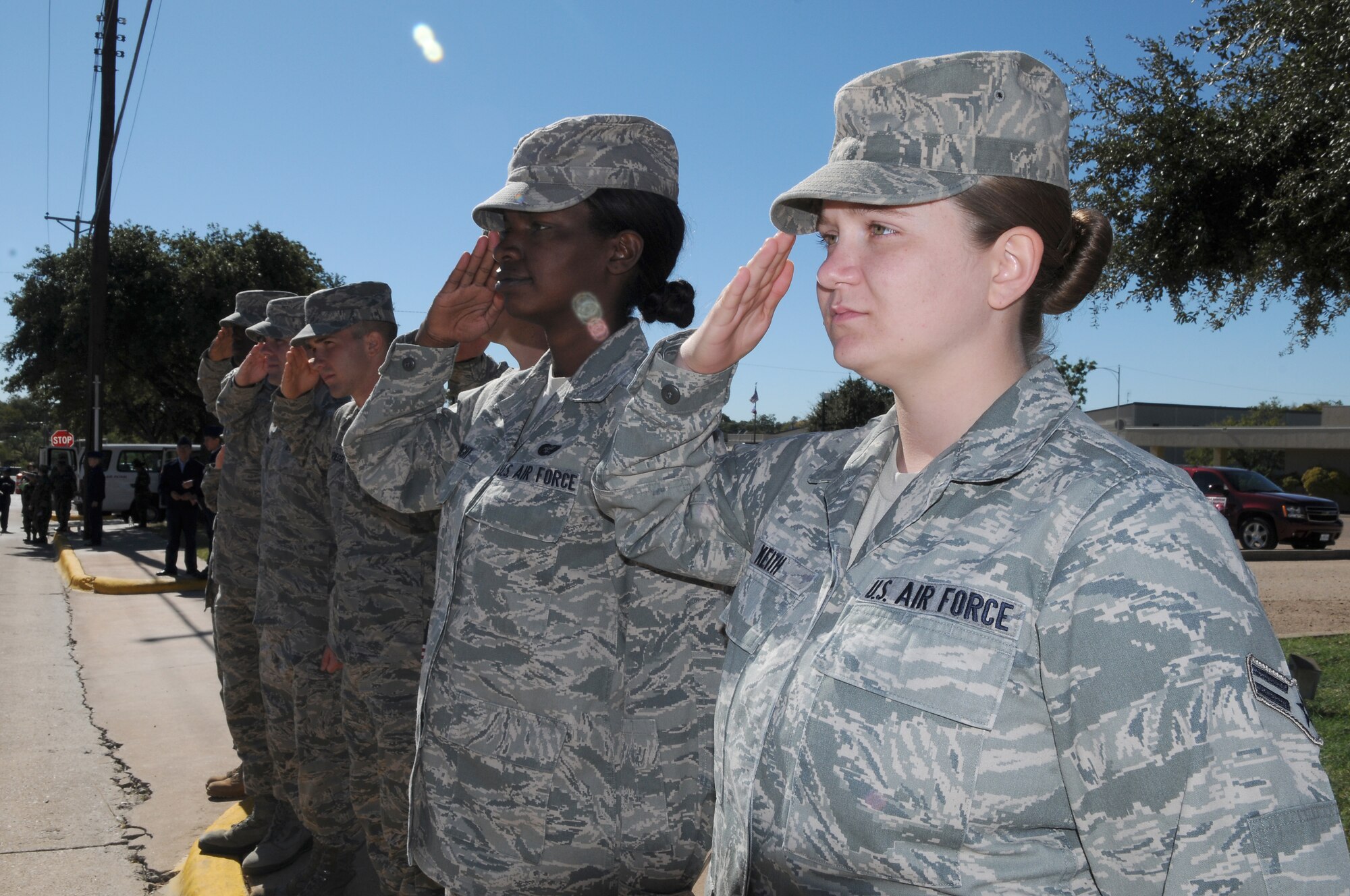SAN ANGELO, Texas – Airman 1st Class Jessica Keith, 17th Training Wing, renders a salute as the United States Flag goes by during the San Angelo Veteran’s Day Parade Nov. 6.  Airman Keith participated in the parade to honor the men and women who have served before her.  (U.S. Air Force photo /Staff Sgt. Heather L Rodgers)
