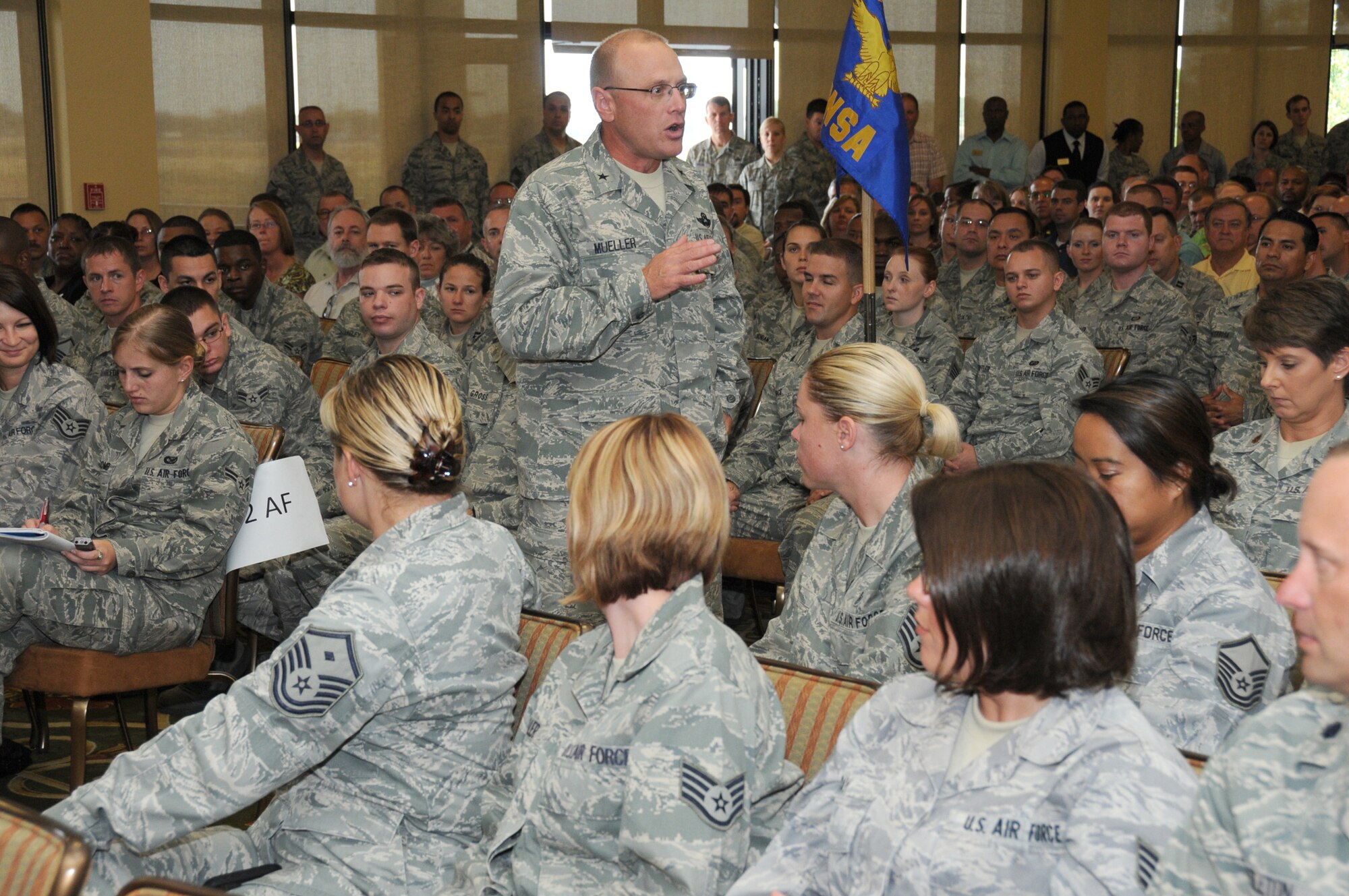 General Mueller congratulates Team Keesler on receiving an ‘excellent’ rating during the UCI outbrief Nov. 2 at the Bay Breeze Event Center.  (U.S. Air Force photo by Kemberly Groue)