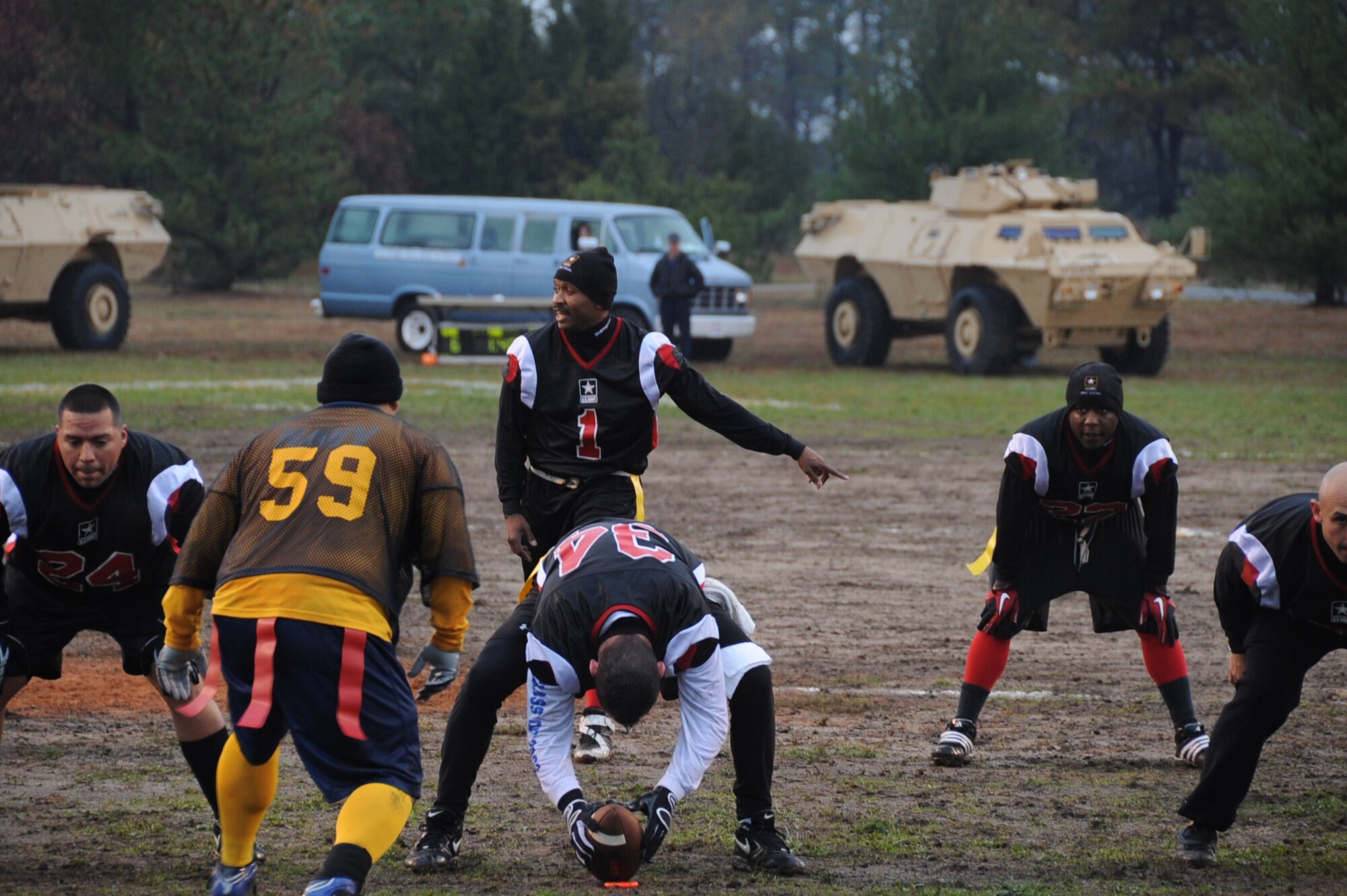 Army quarterback Terrence Garrett sets up his offense two yards away from the goal line during the annual Army versus Navy flag football game Nov. 4 at Joint Base McGuire-Dix-Lakehurst. Garrett ran the ball in for a touchdown to tie the game early in the second half. With the score tied, running back Lawrence Jackson gave Army the lead with a 15-yard touchdown run with four minutes left in the game. Army held off Navy for the second year in a row, winning 13-6. (U.S. Air Force photo/Airman 1st Class Bryan Swink)