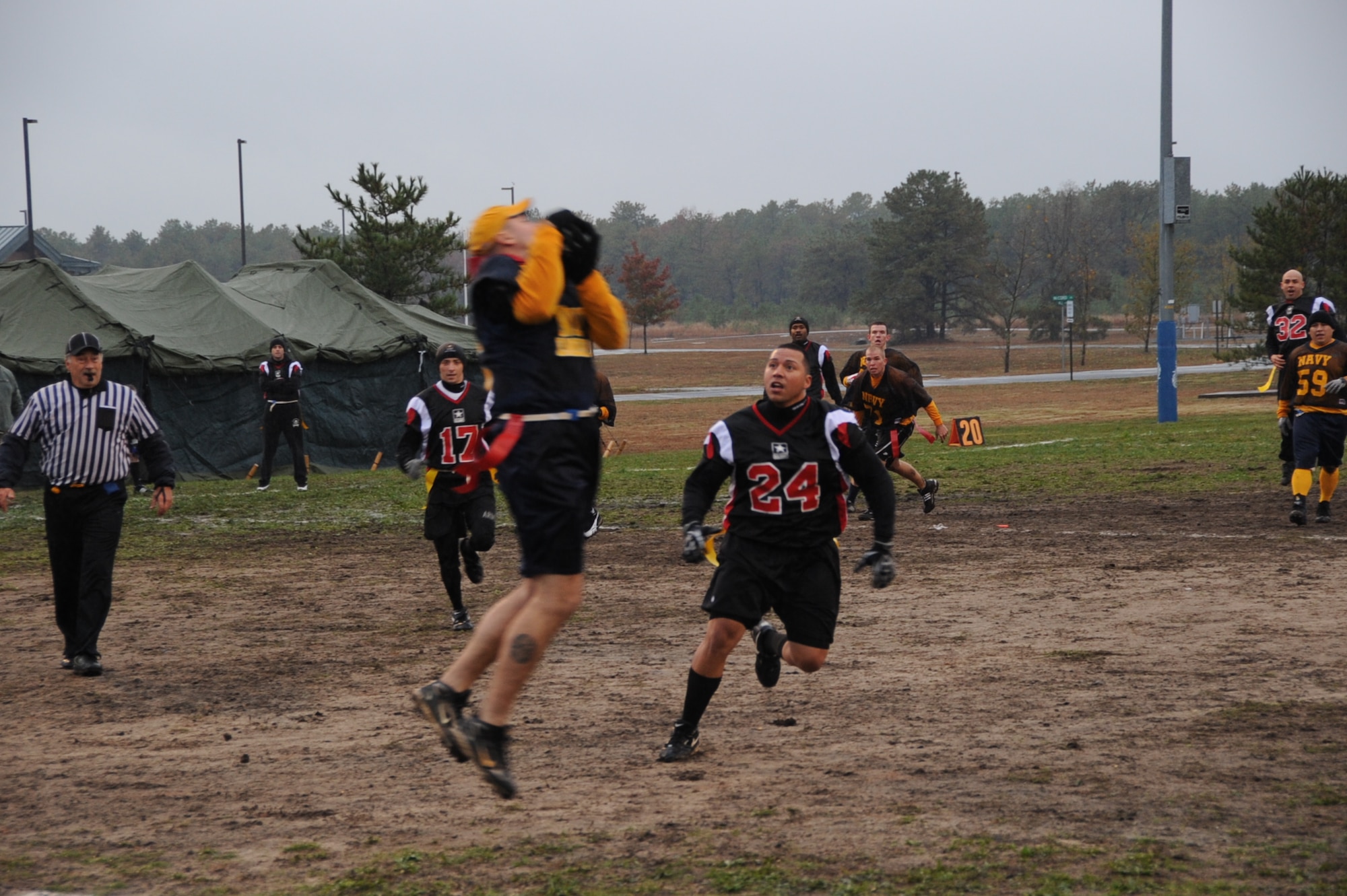 Navy defensive back Glenn Kildare intercepts a pass thrown by Army quarterback Terrence Garrett during the first half of the annual Army versus Navy flag football game Nov. 4 at Joint Base McGuire-Dix-Lakehurst. Kildare’s interception set up the Navy to take an early 6-0 lead before halftime. Unfortunately for Navy, they weren’t able to hold the lead as Army put 13 points on the board to win the game 13-6. (U.S. Air Force photo/Airman 1st Class Bryan Swink)
