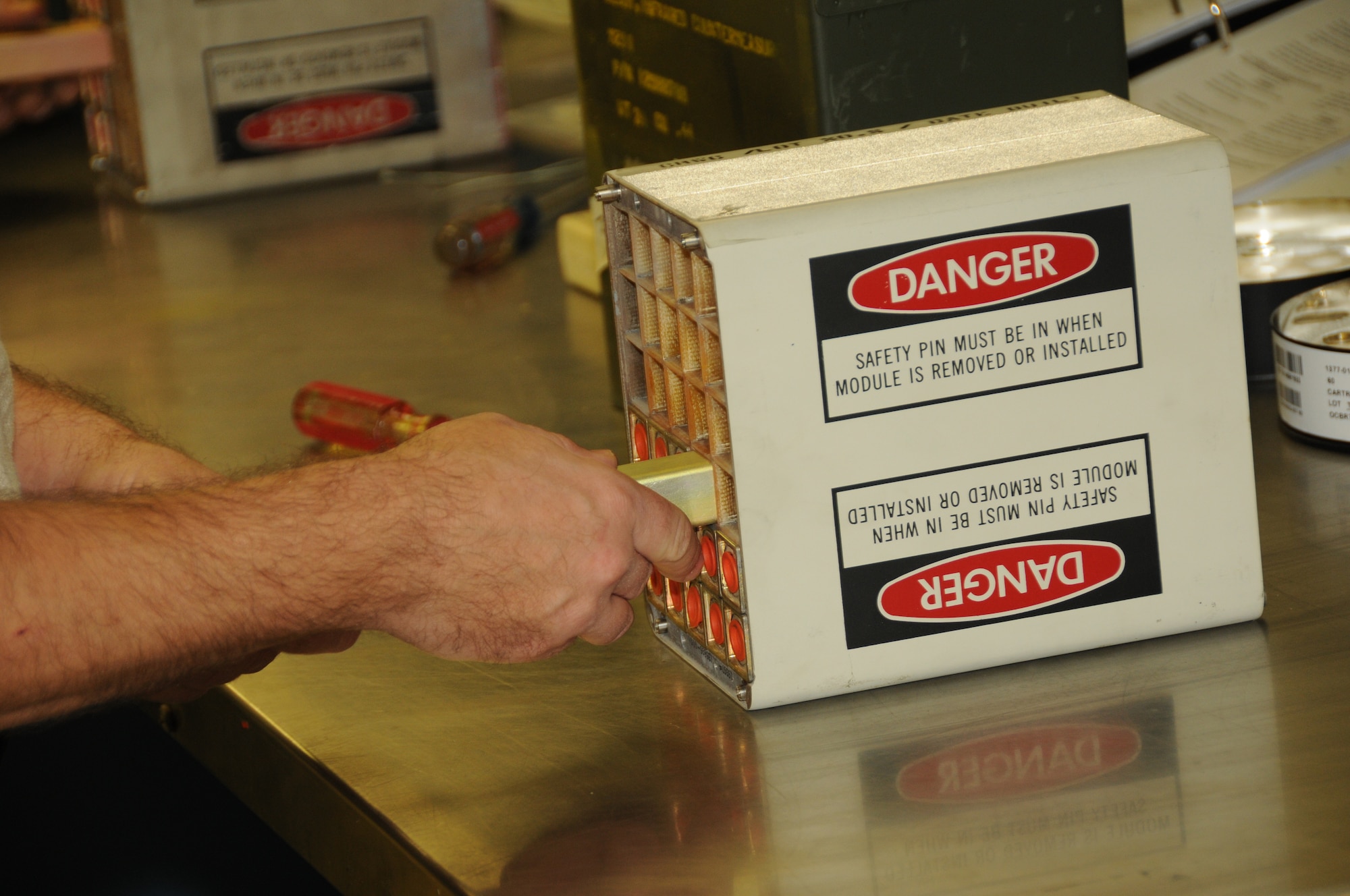 M211 decoys are loaded into one of the 18 Modules that will be place on a C-130 for an upcoming exercise. Each module holds 36 M211 decoys that burn at 2000 degrees Fahrenheit and are used by aircraft to confuse the tracking system of heat seeking missiles. (U.S. Air Force photo/Senior Master Sgt. Ray Lloyd)  