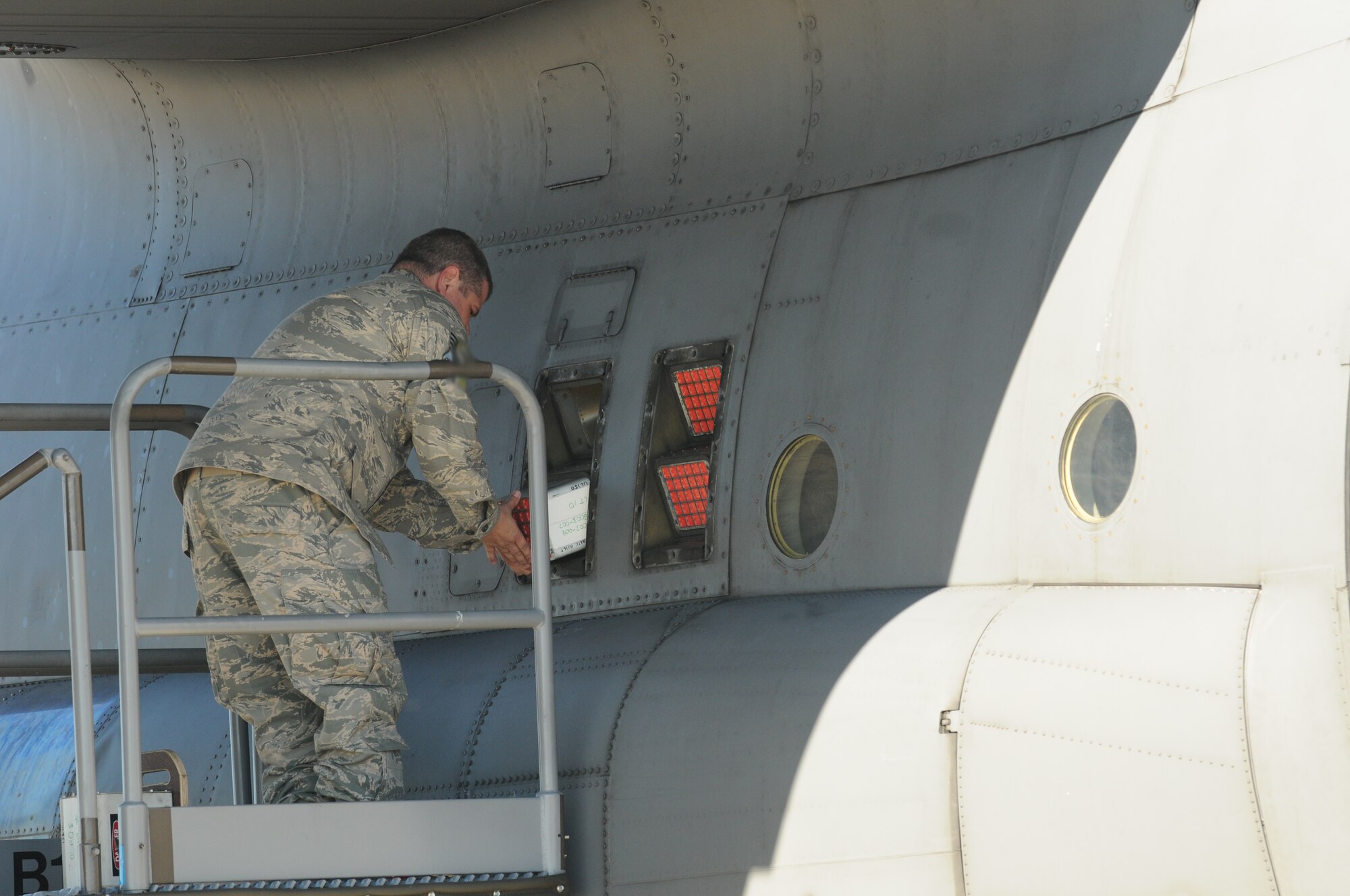 Tech. Sgt. Robert Osborn, 107th Airlift Wing, loads a module filled with 36 M206 flares into one of the 18 module slots on a C-130. M206 decoys are used by aircraft to fend off infrared seeking missile. (U.S. Air Force photo/Senior Master Sgt. Ray Lloyd)  