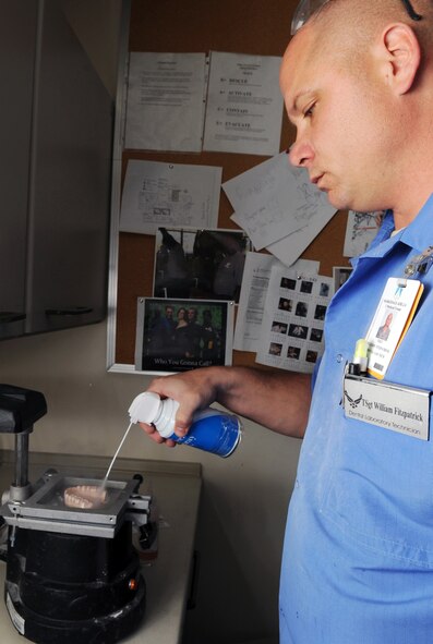 Tech. Sgt. William Fitzpatrick, 2nd Dental Squadron, laboratory technician, prepares to make a sports guard from a patient's diagnostic cast at Barksdale Air Force Base, La., Nov. 9. The 2 DS works and train as a team to maintain a maximum state of readiness for deployers while providing quality service to its internal and external customers. (U.S. Air Force photo/Senior Airman Brittany Y. Bateman)(RELEASED)